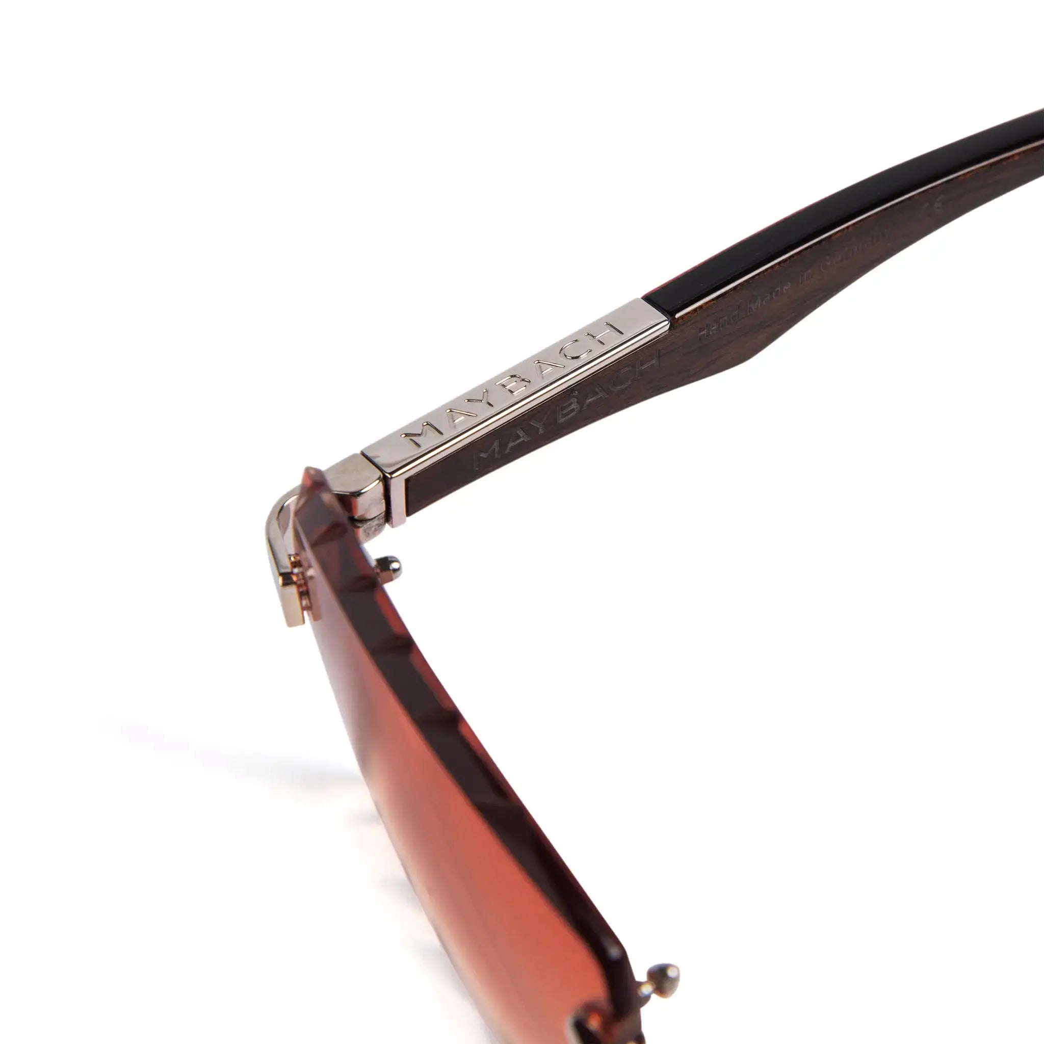 Logo view of Maybach Eyewear The Artist III P-WBZ-ZZ5 Custom Brown Fade Diamond Cut Sunglasses 