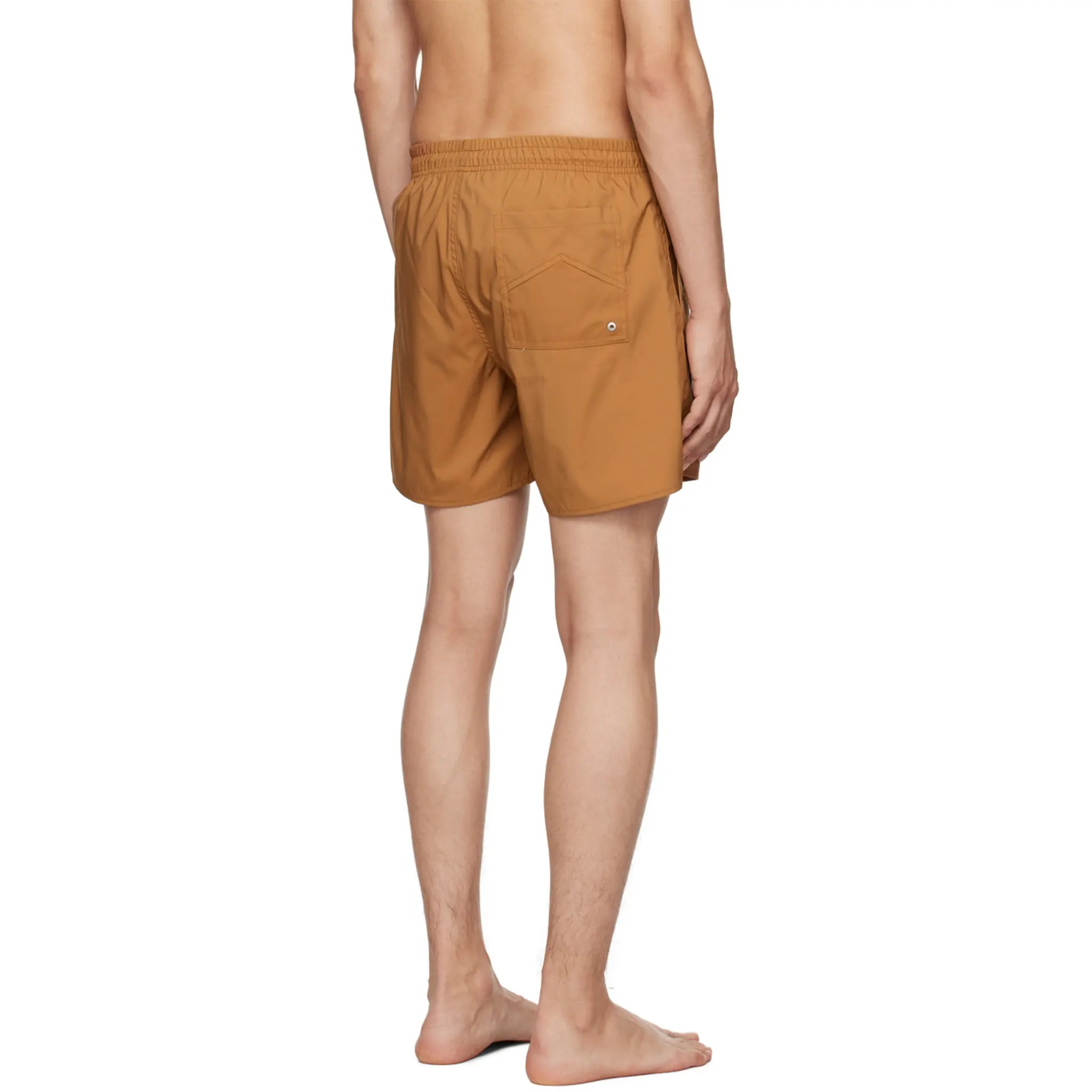 Model back view of Rhude Logo Swim Shorts Camel RHPF23SM01169003