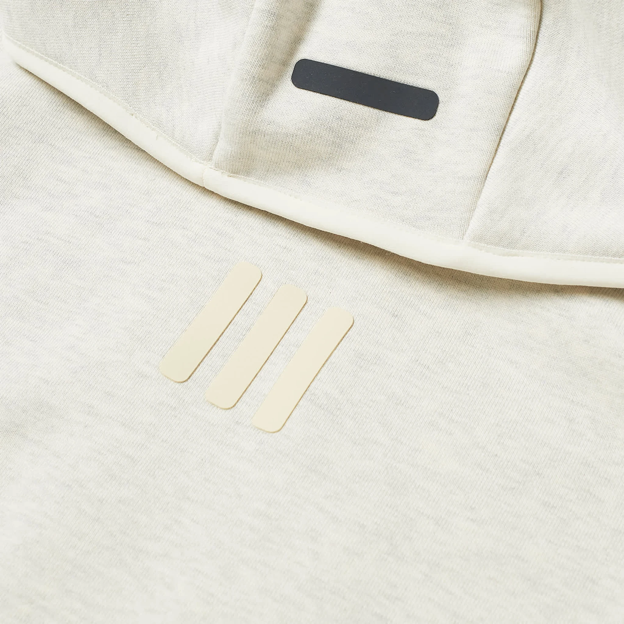 Front detail view of Adidas x Fear Of God Athletics Heavy Fleece Oatmeal Heather Hoodie IS5308 