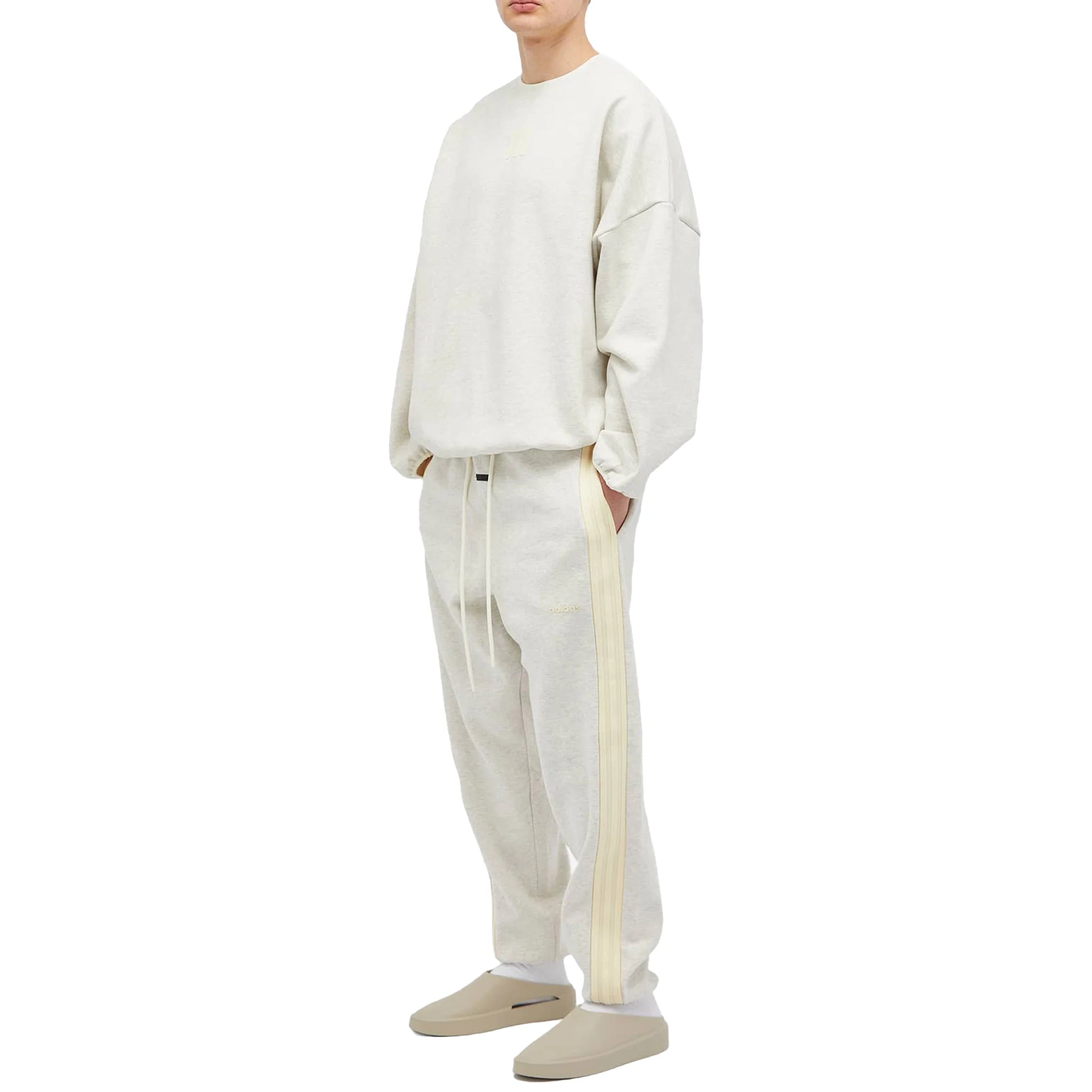 Model side view of Adidas x Fear of God Athletics Heavy Fleece Oatmeal Heather Sweatpants 