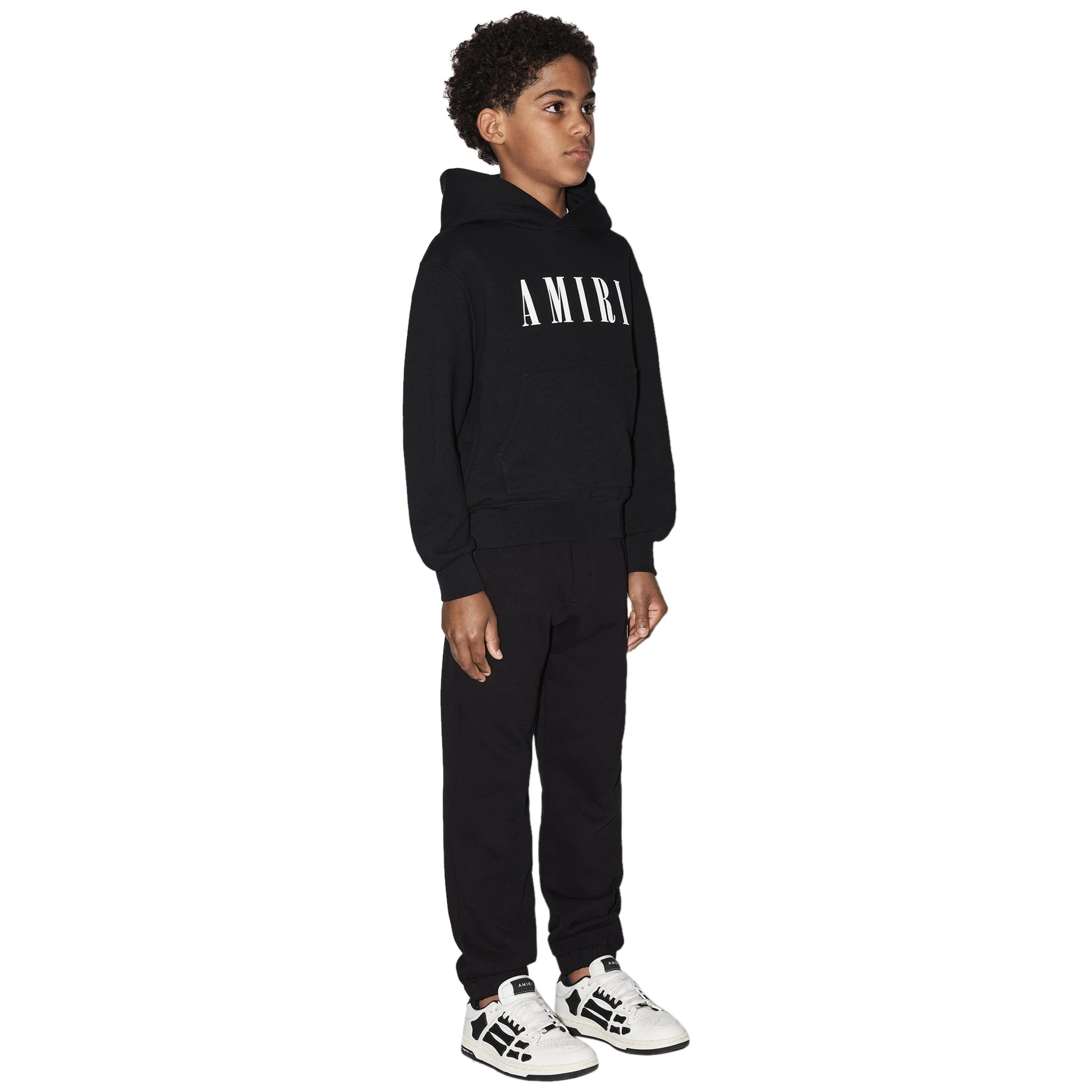 Model side view of Amiri Kids 'Amiri' Black Hoodie PS23KJL001-001