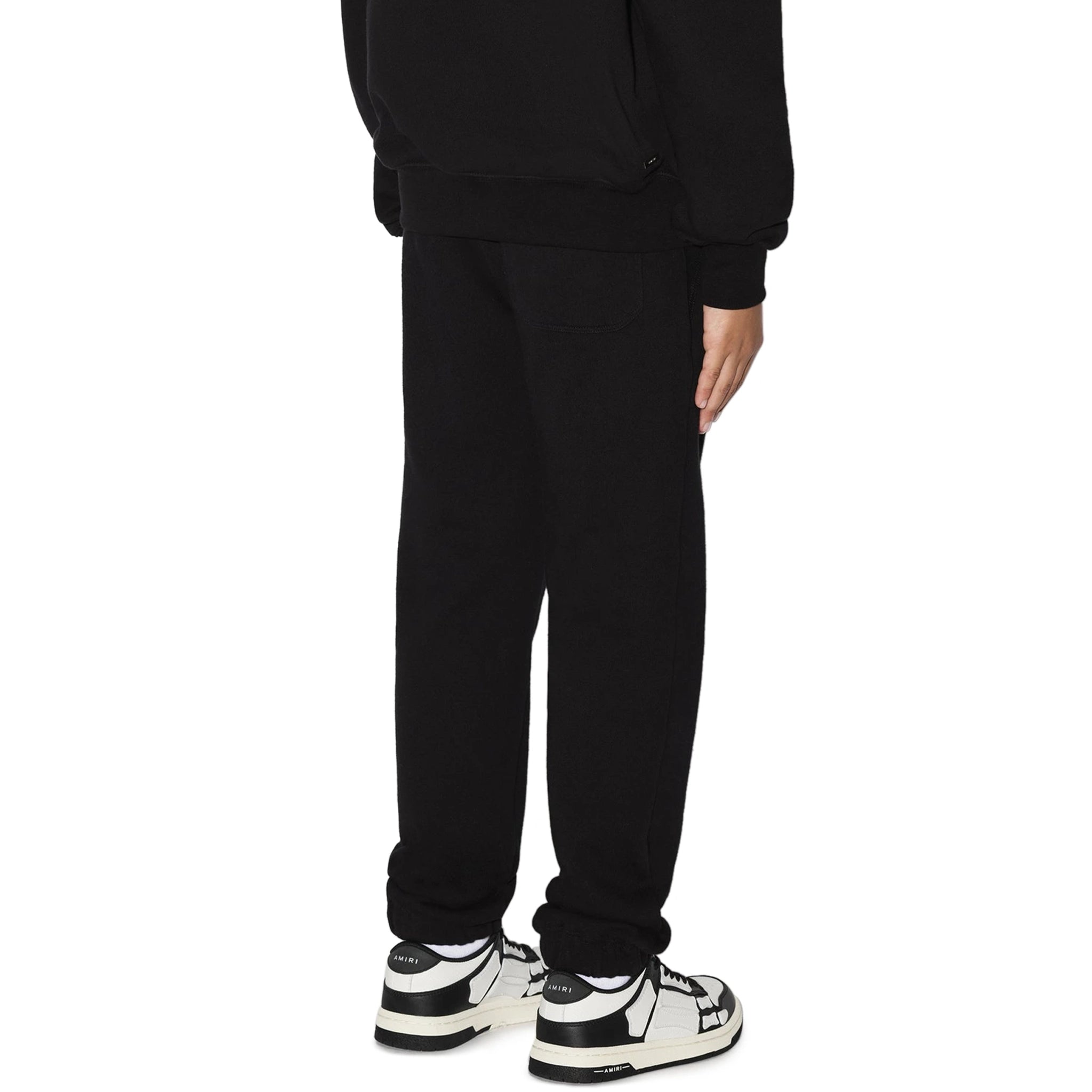 Model back view of Amiri Kids 'Amiri' Black Sweatpants PS23KJL003-001