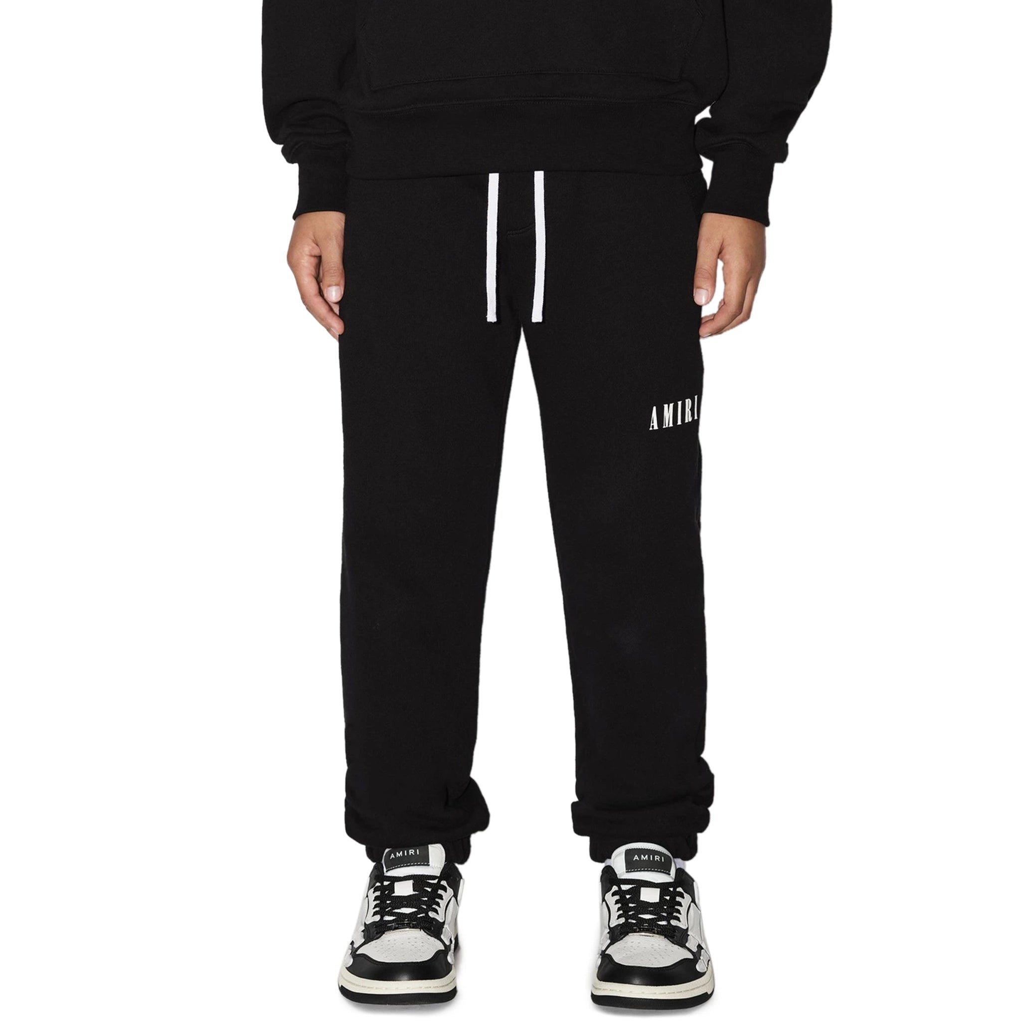 Model fromt view of Amiri Kids 'Amiri' Black Sweatpants PS23KJL003-001