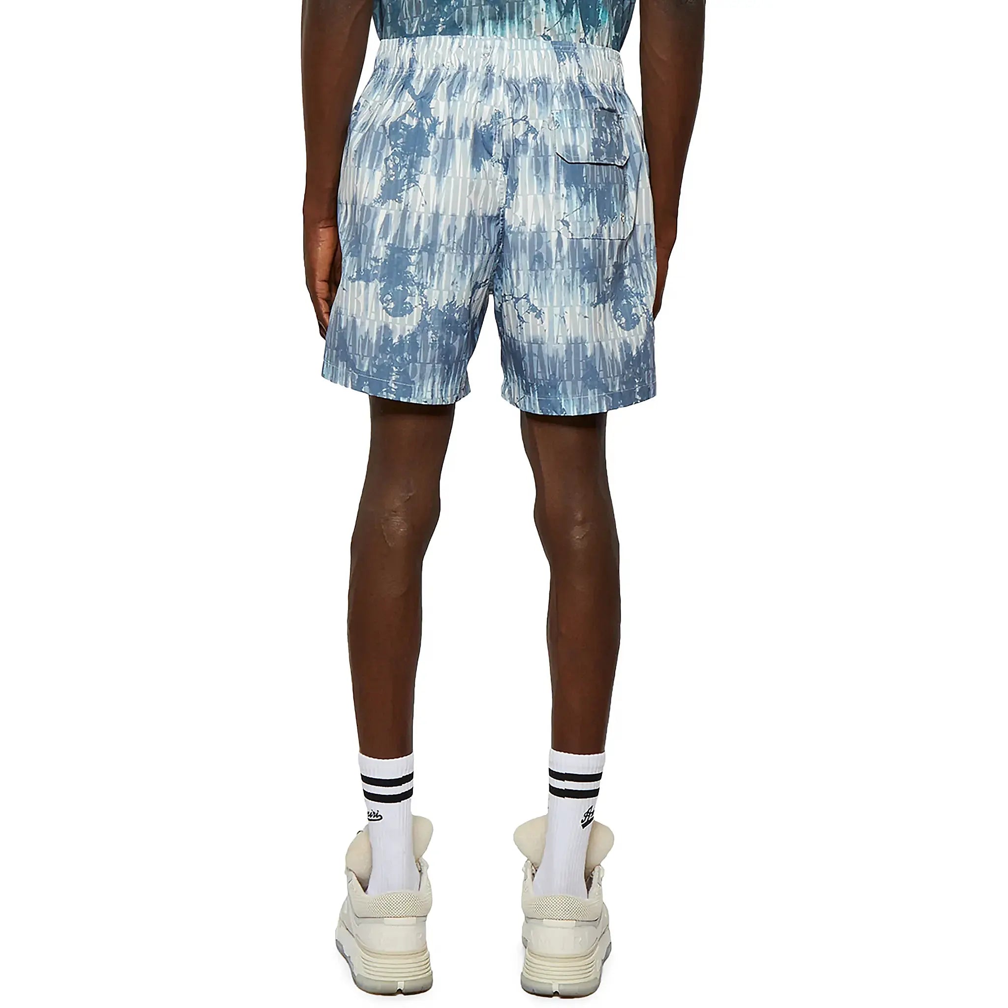 Model back view of Amiri Tie Dye Blue Swim Shorts SS23MSB002-420