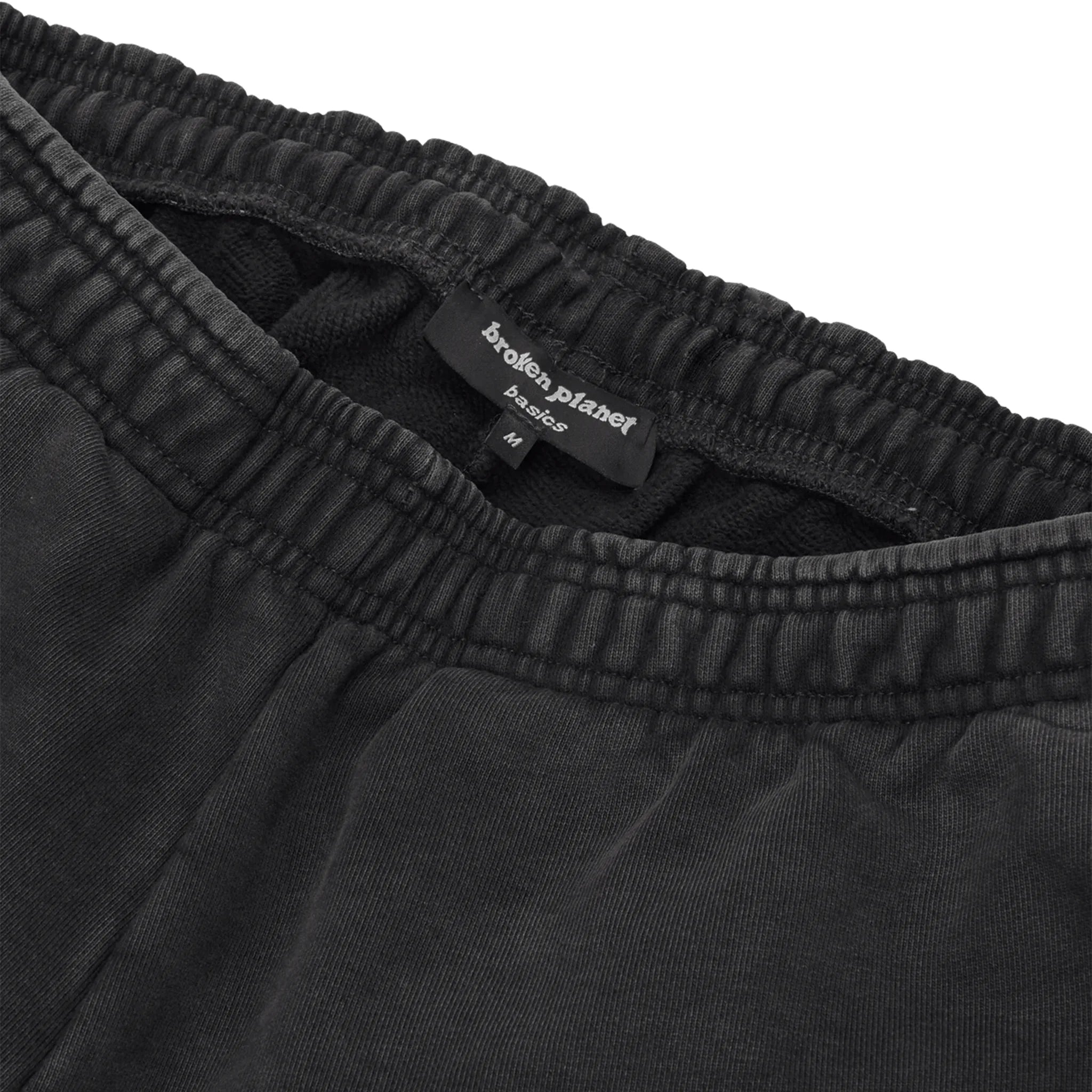 Waiste view of Broken Planet Basics Wide Leg Washed Midnight Black Sweatpants