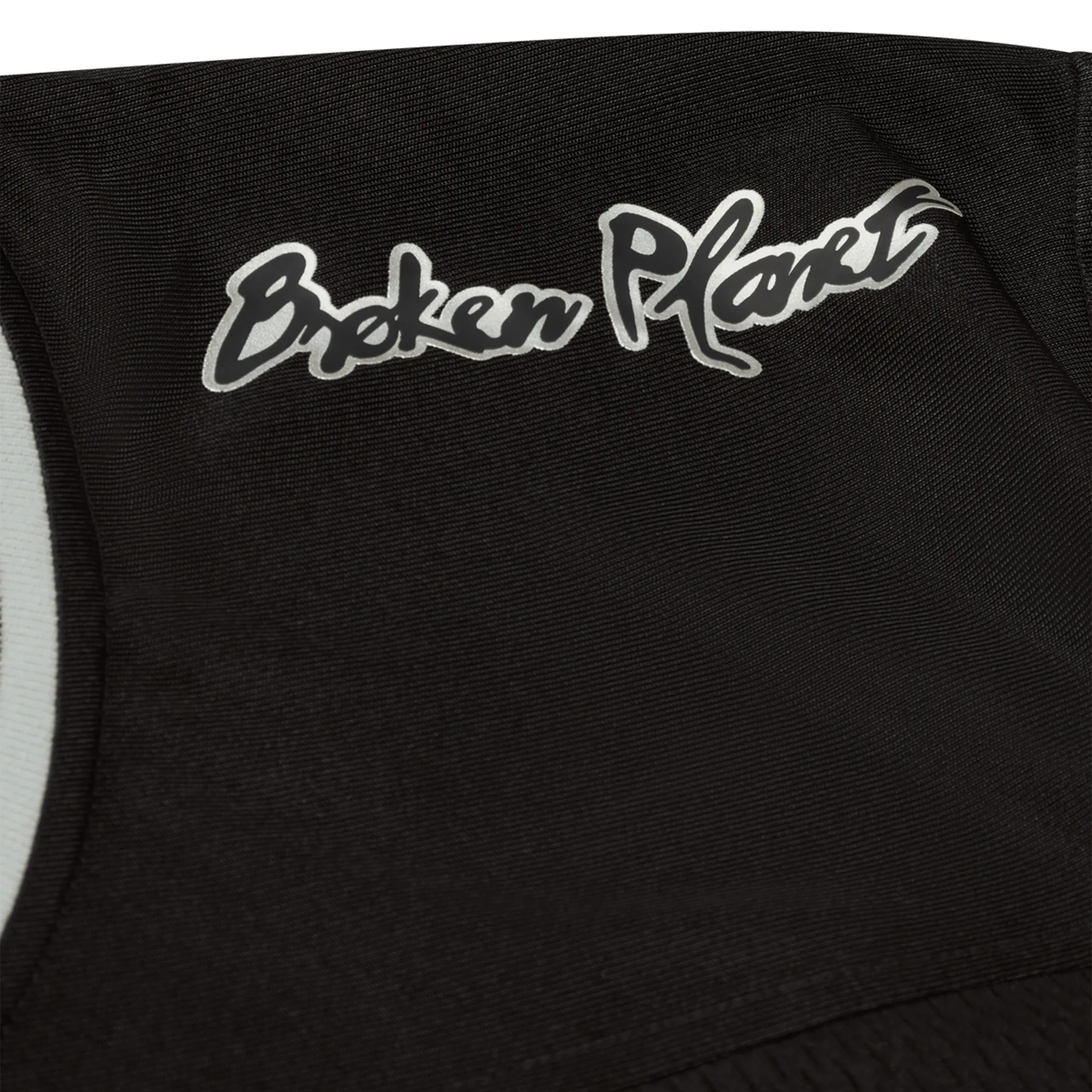 Shoulder view of Broken Planet Black Silver Football Jersey BP-CS25-AFJ-BLACK_SILVER