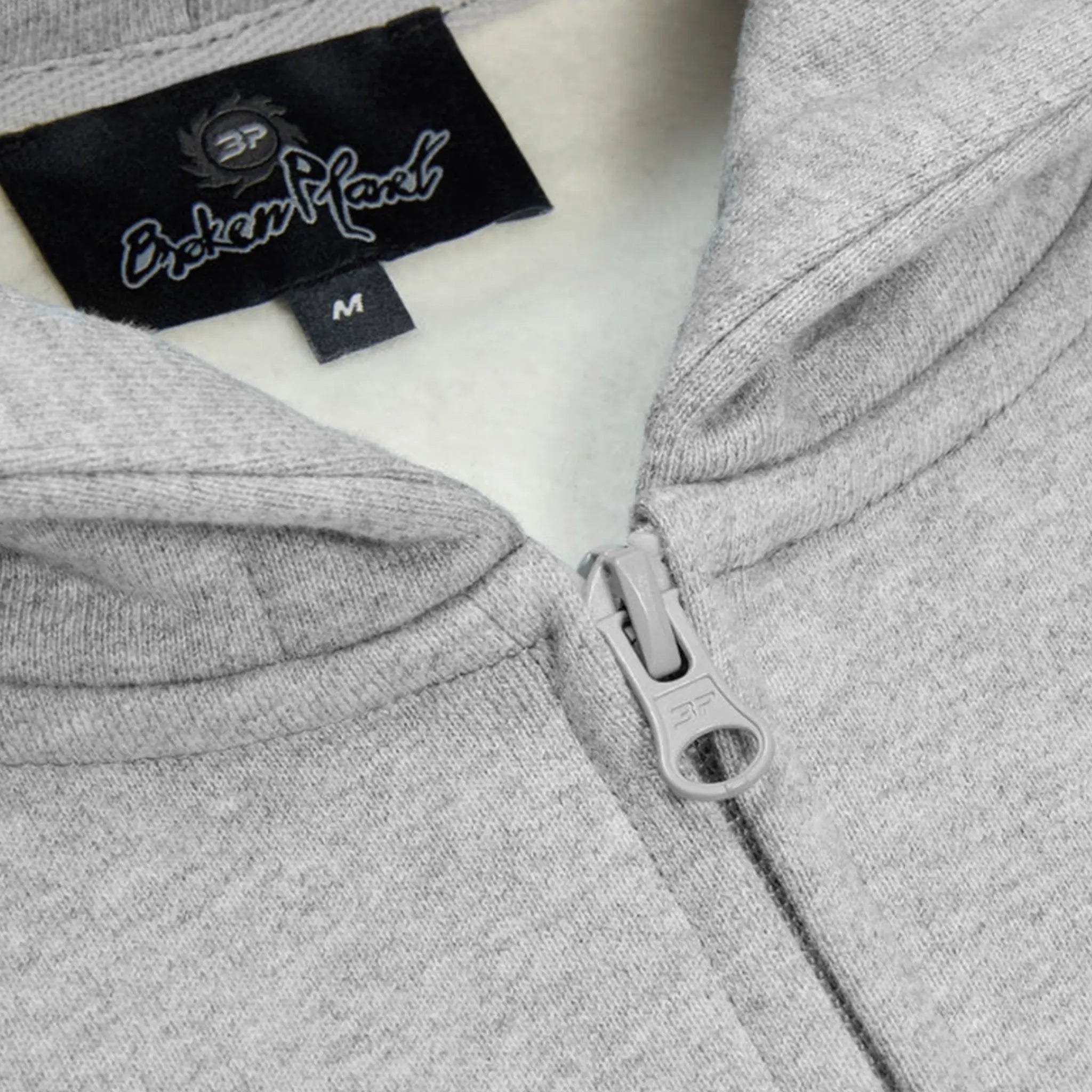 Zip view of Broken Planet Sun Heather Grey Zip-Up Hoodie 