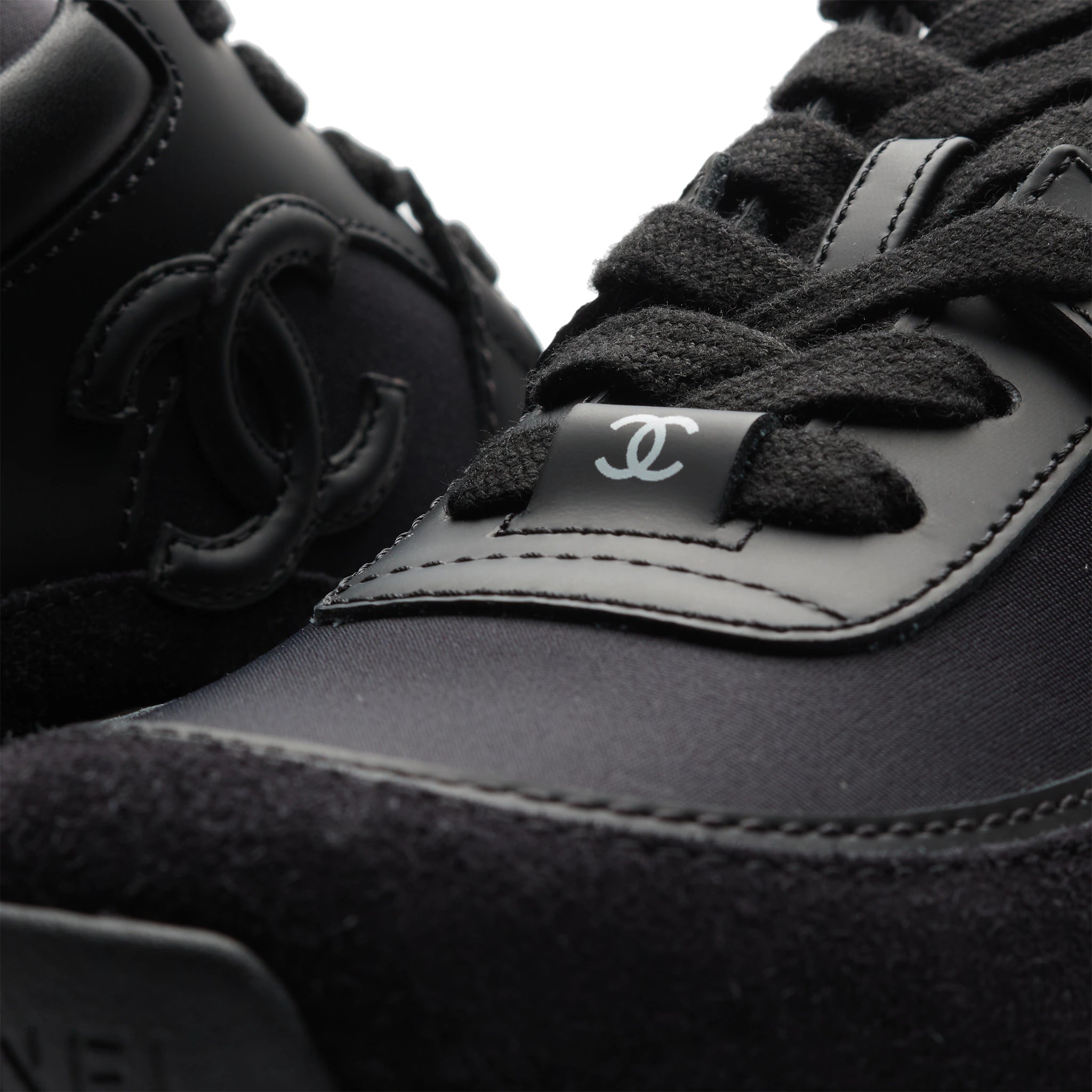Detail view of Chanel CC Logo Suede Triple Black Sneaker