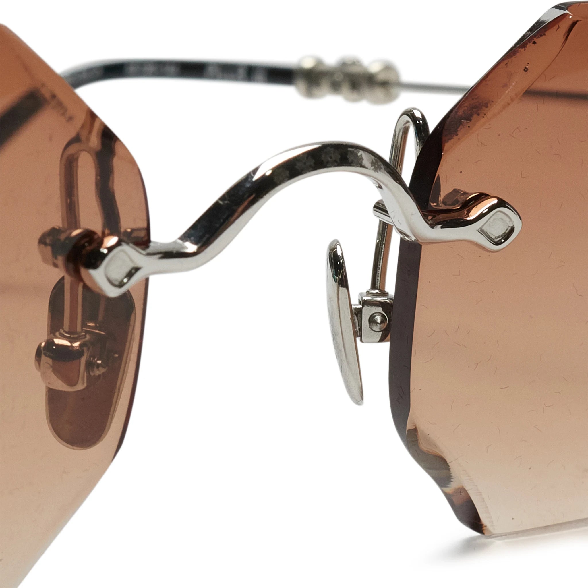 Nose bridge view of Chrome Hearts Pills III Custom Silver Brown Diamond Cut Sunglasses