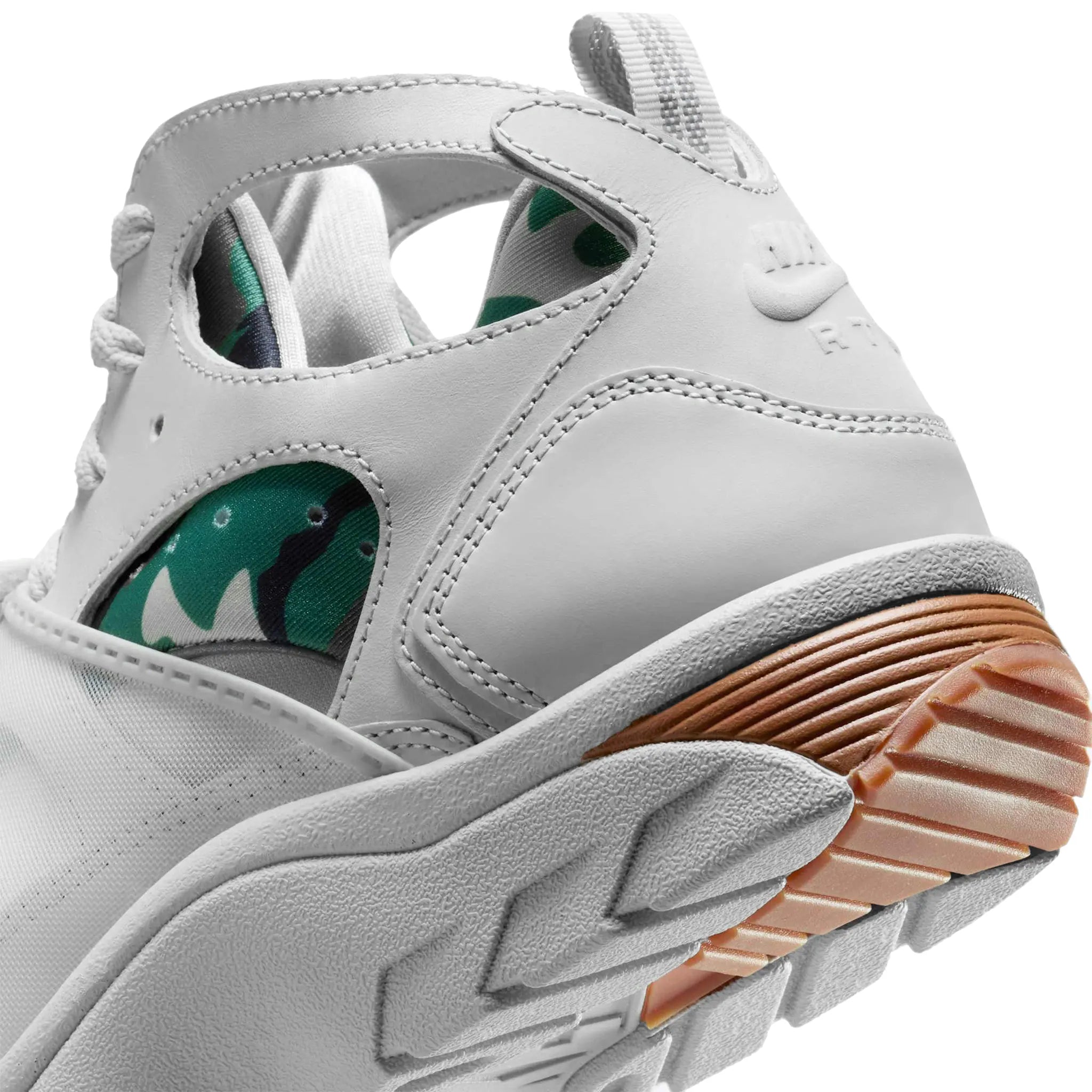 Heel view of Corteiz x Nike Air Huarache Light Bone