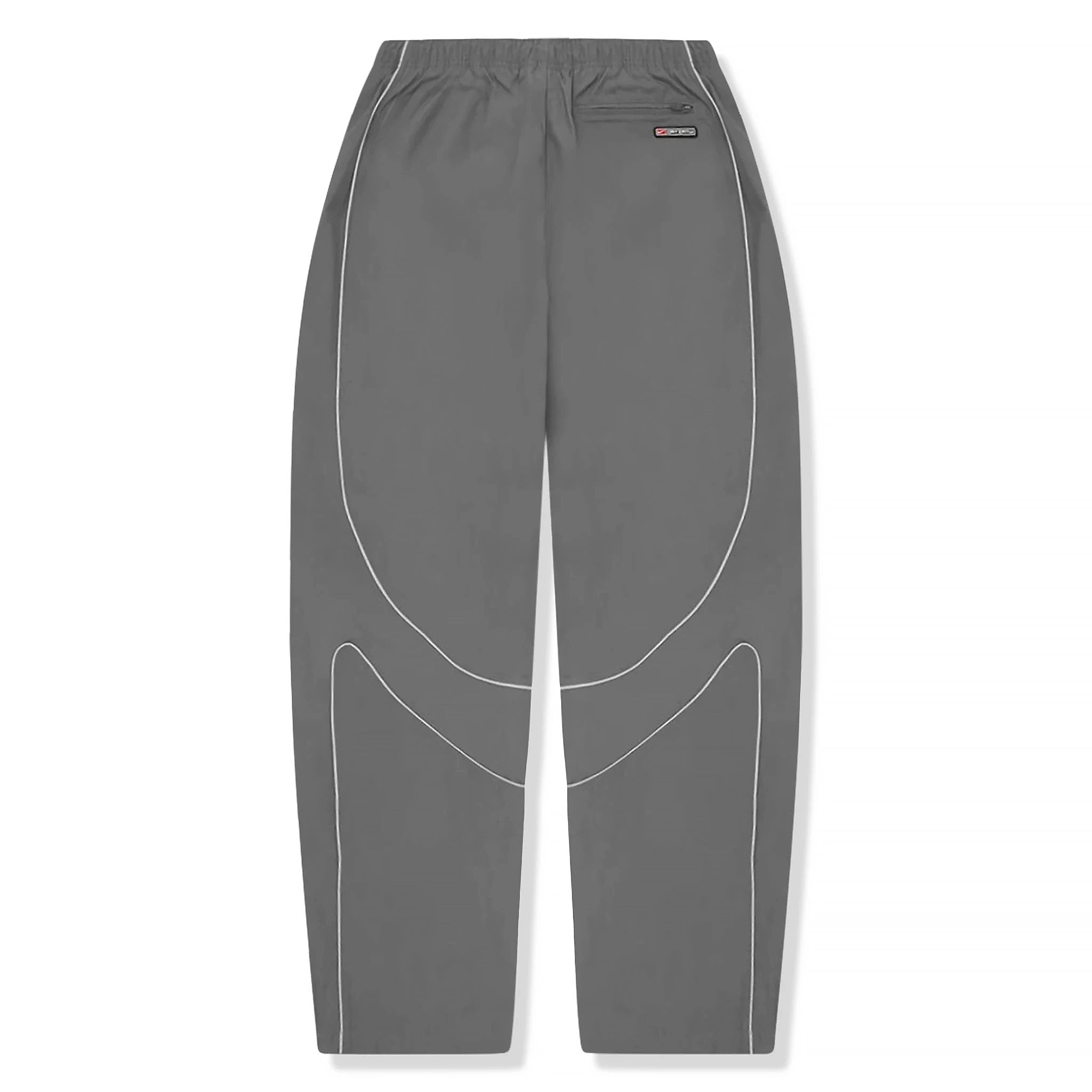 Back view of Corteiz x Nike Gully Grey Track Pants