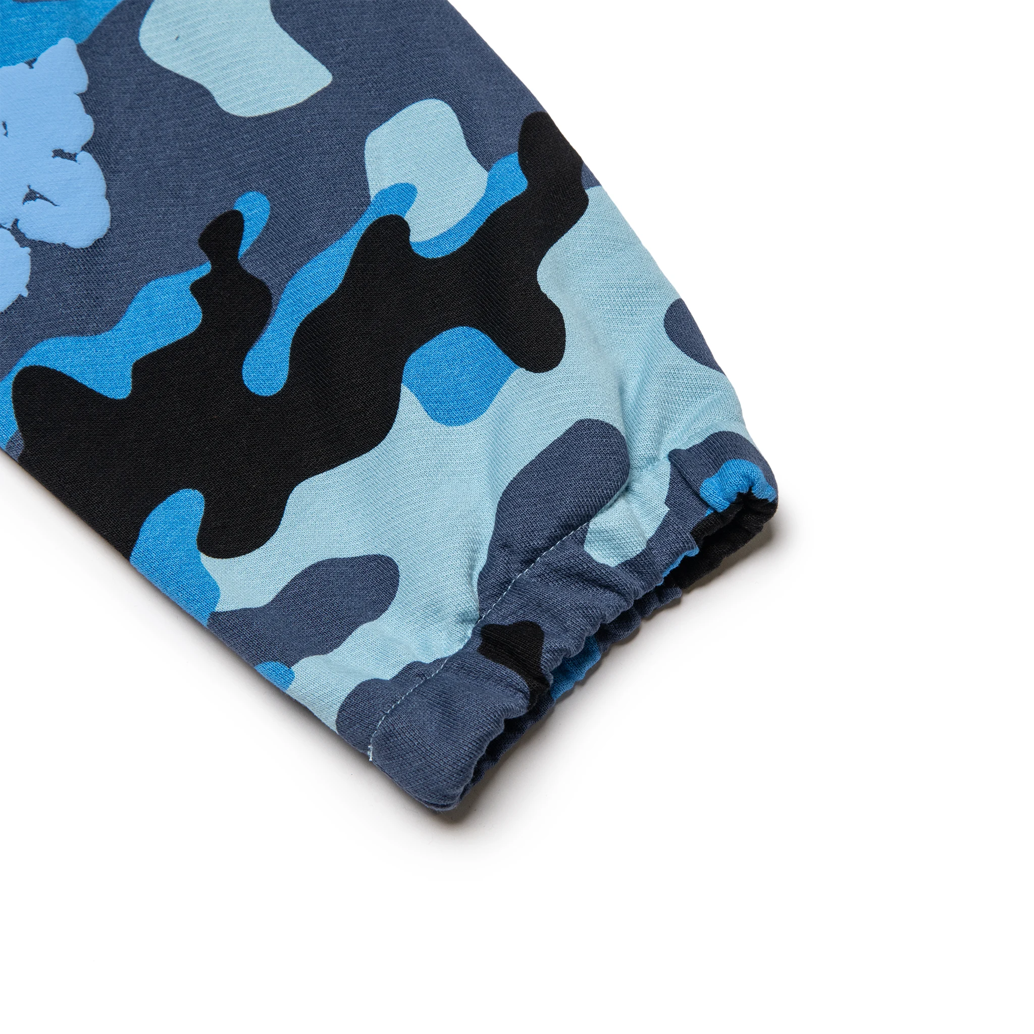 Leg view of Denim Tears Blue Camo Cotton Wreath Sweatpants