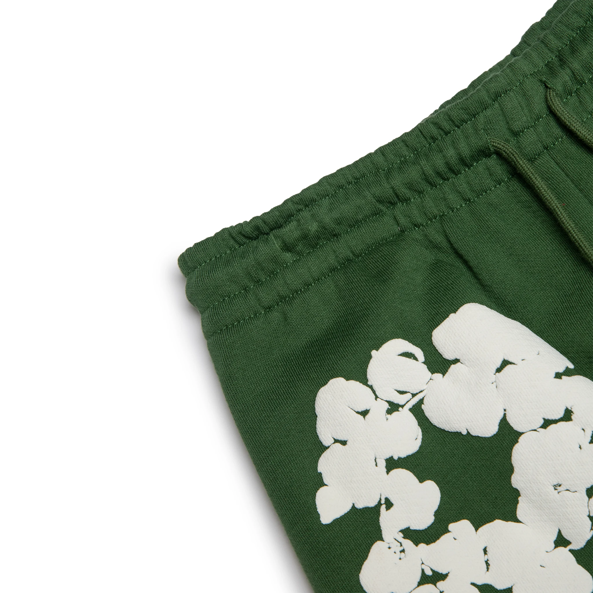 Waist view of Denim Tears The Cotton Wreath Green Sweatpants 