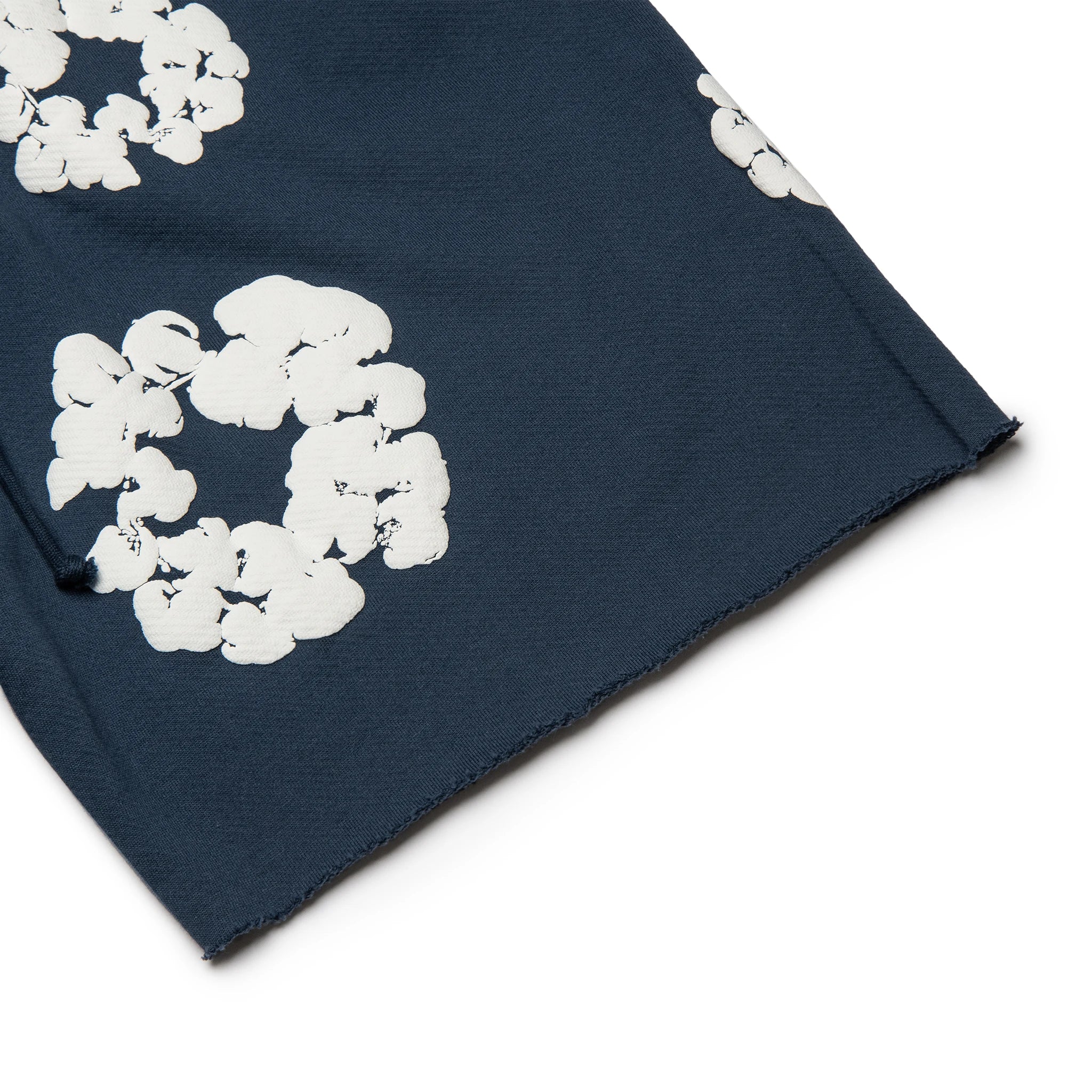 Leg view of Denim Tears The Cotton Wreath Navy Shorts