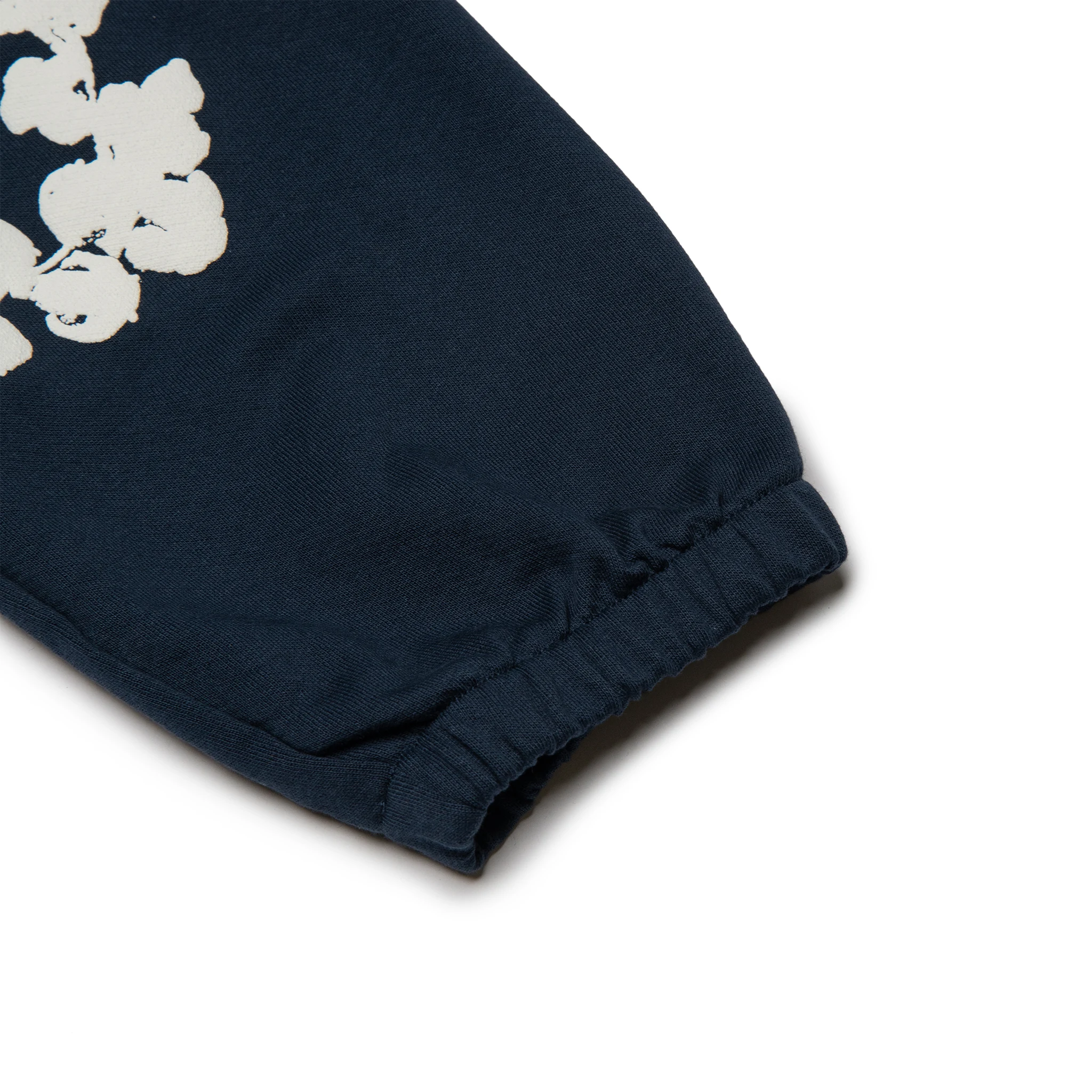 Leg view of Denim Tears The Cotton Wreath Navy Sweatpants 
