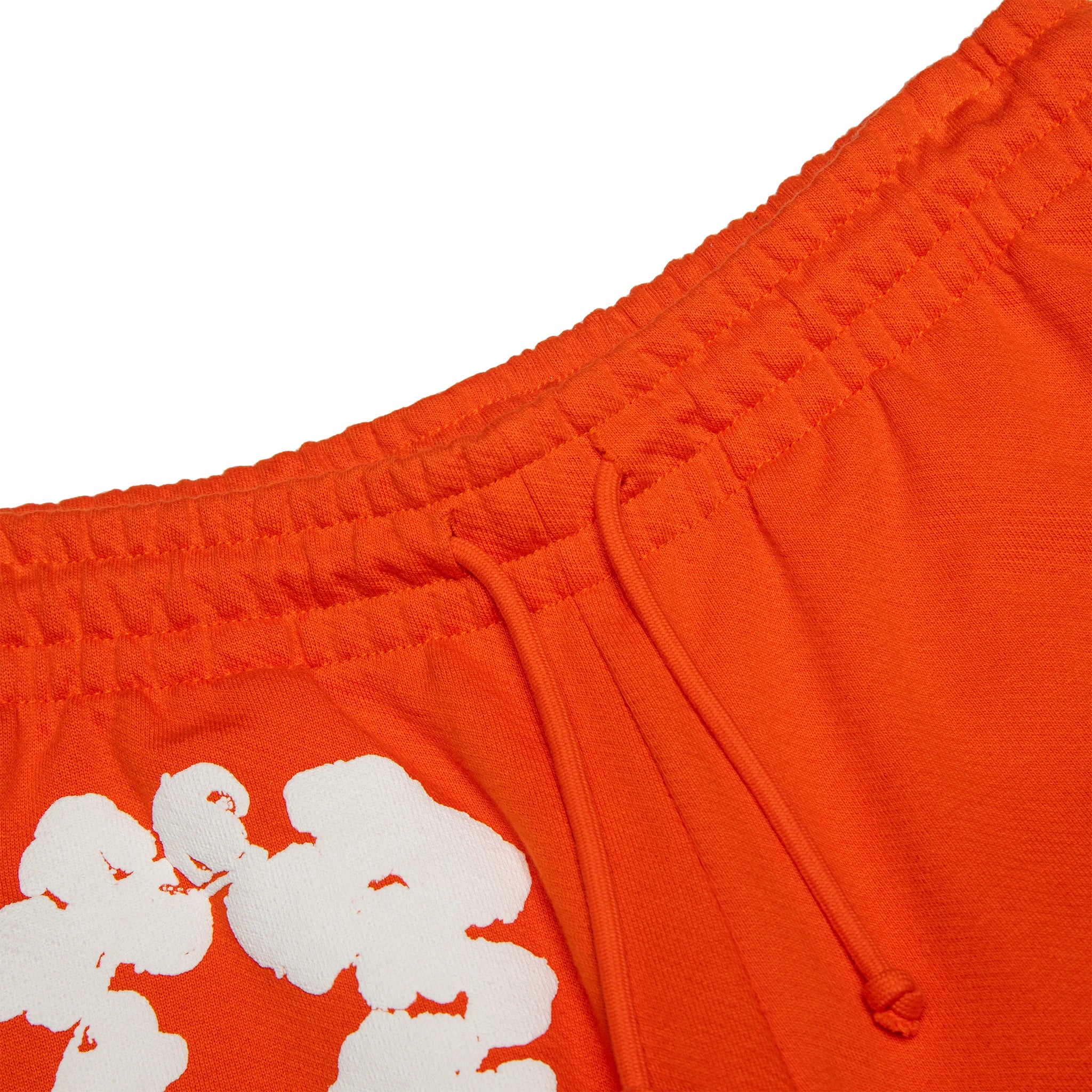 Waist view of Denim Tears The Cotton Wreath Orange Sweatpants 