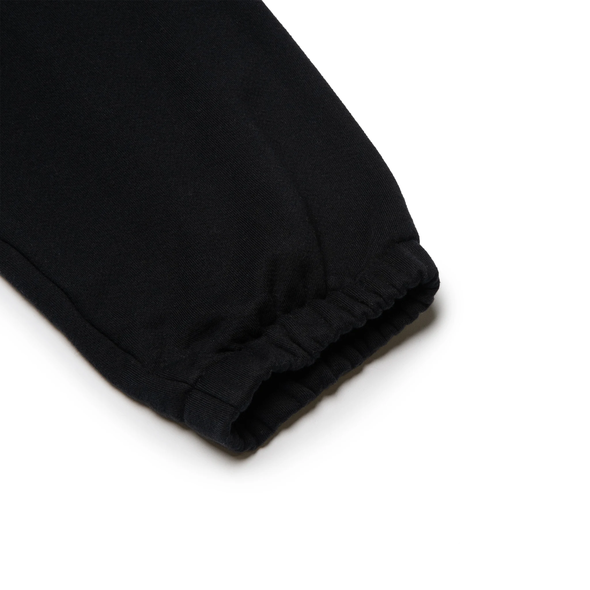 Leg view of Denim Tears University Black Sweatpants 