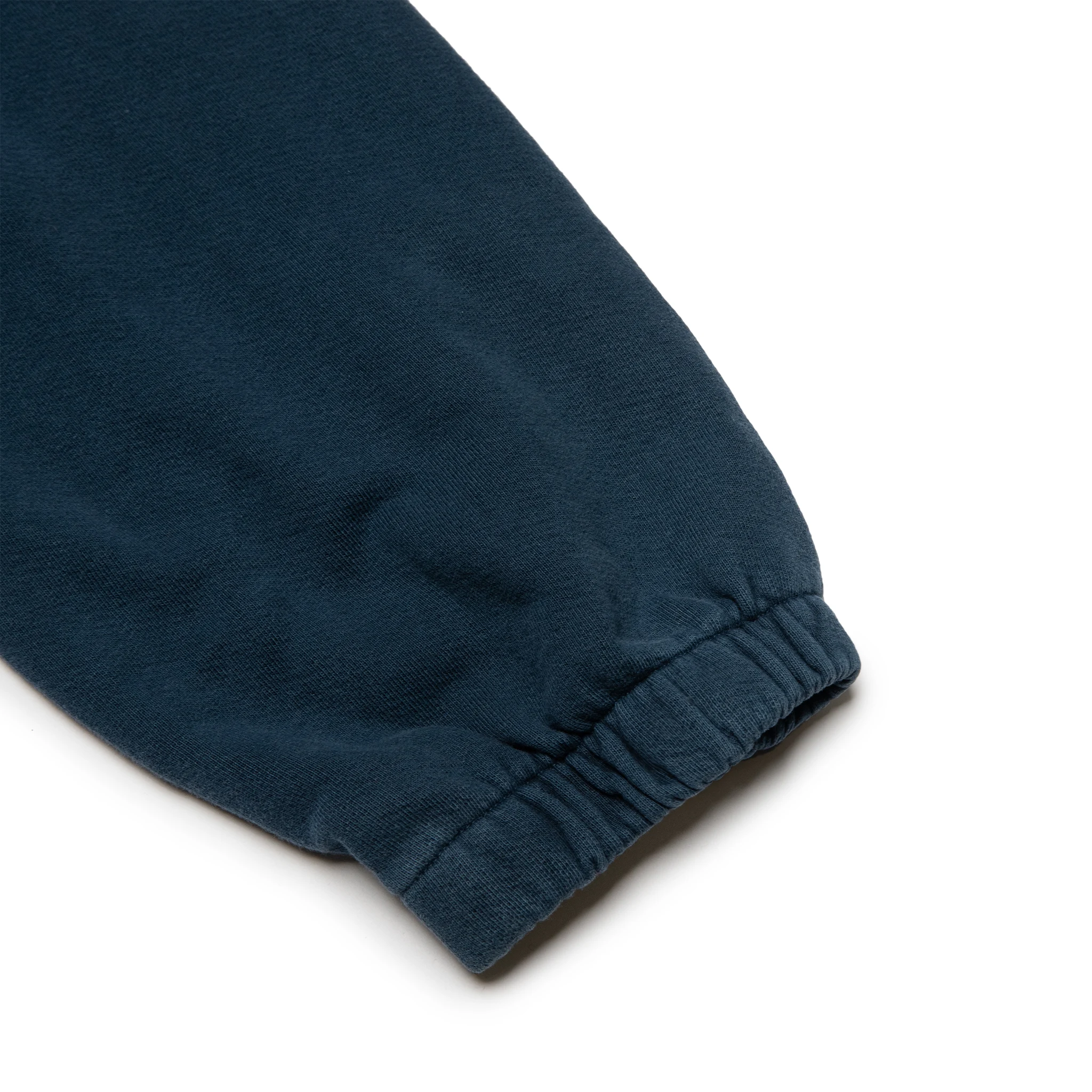 Leg view of Denim Tears University Navy Sweatpants 