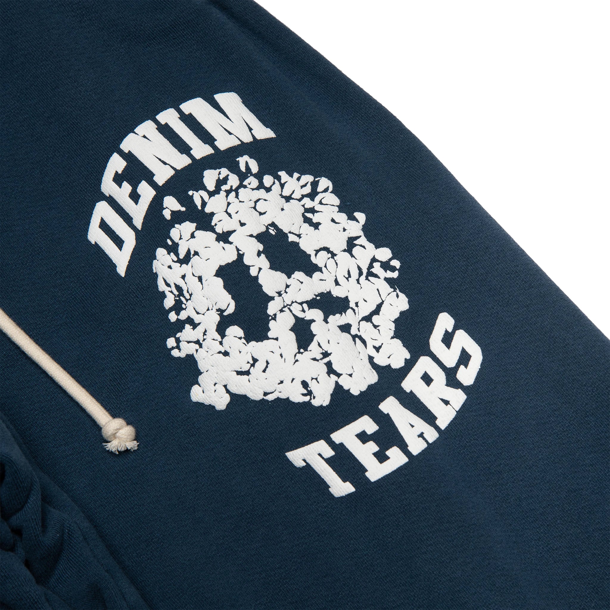 Logo view of Denim Tears University Navy Sweatpants 