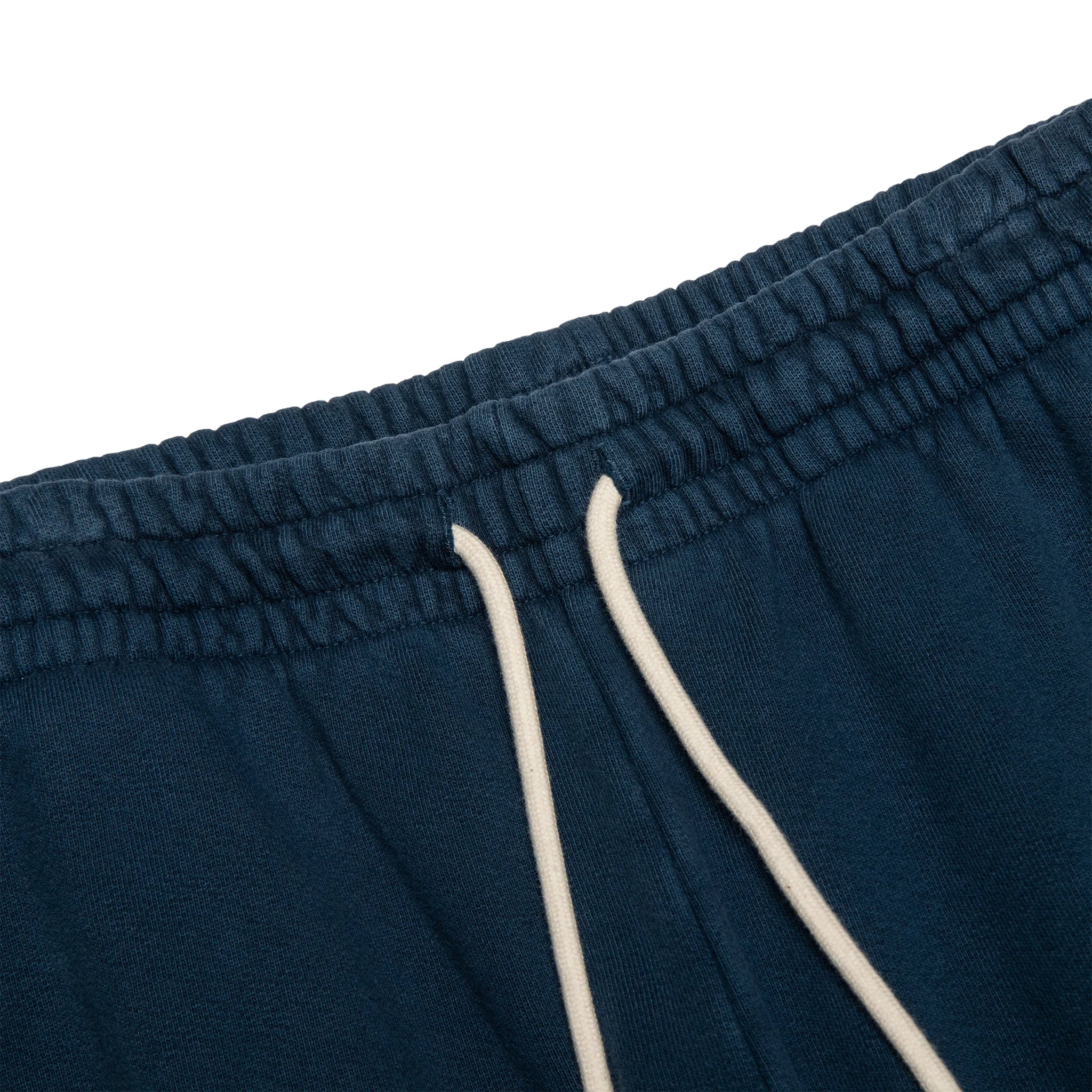Strings view of Denim Tears University Navy Sweatpants 