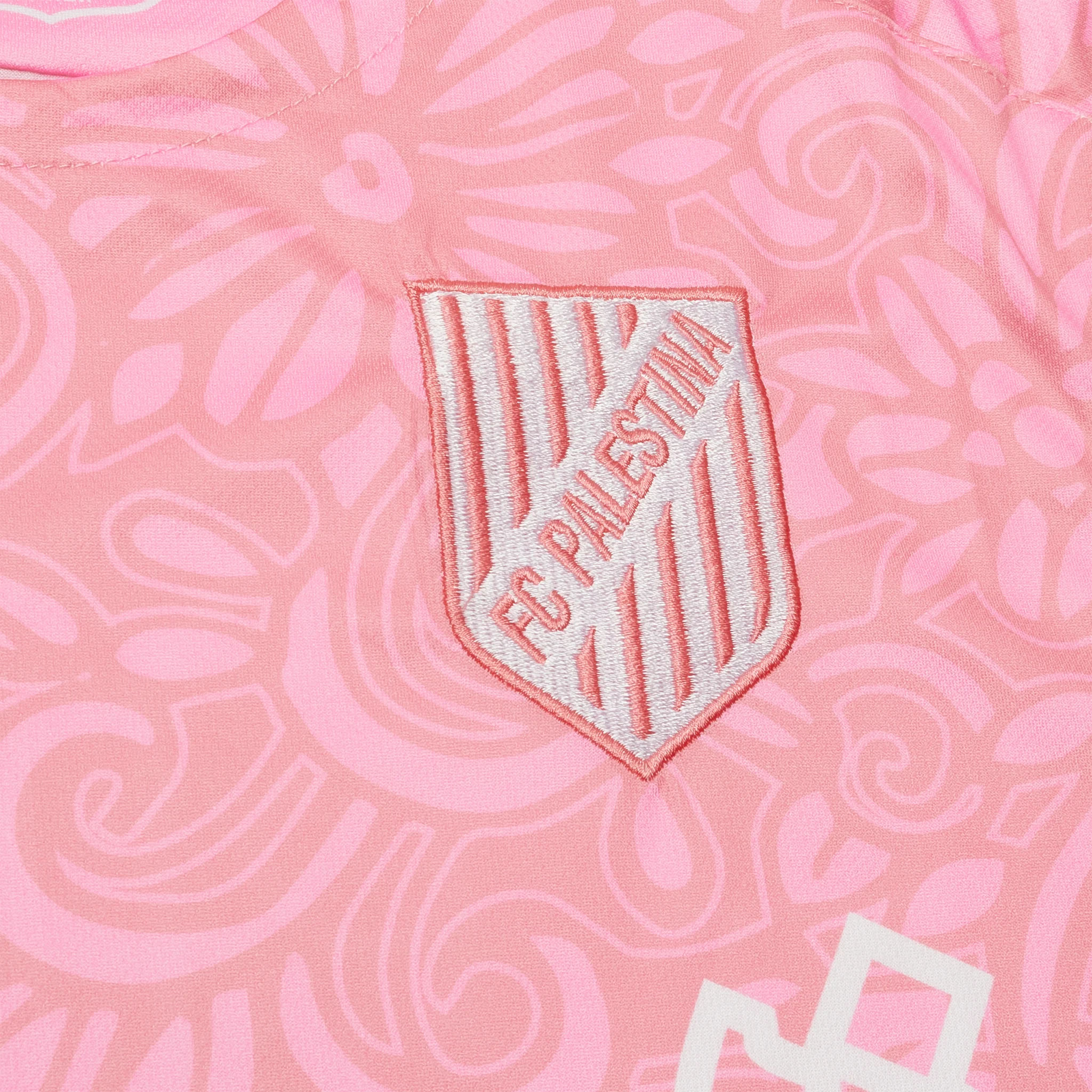 Logo detail view of FC Palestina x Farrah Azam Pink T Shirt