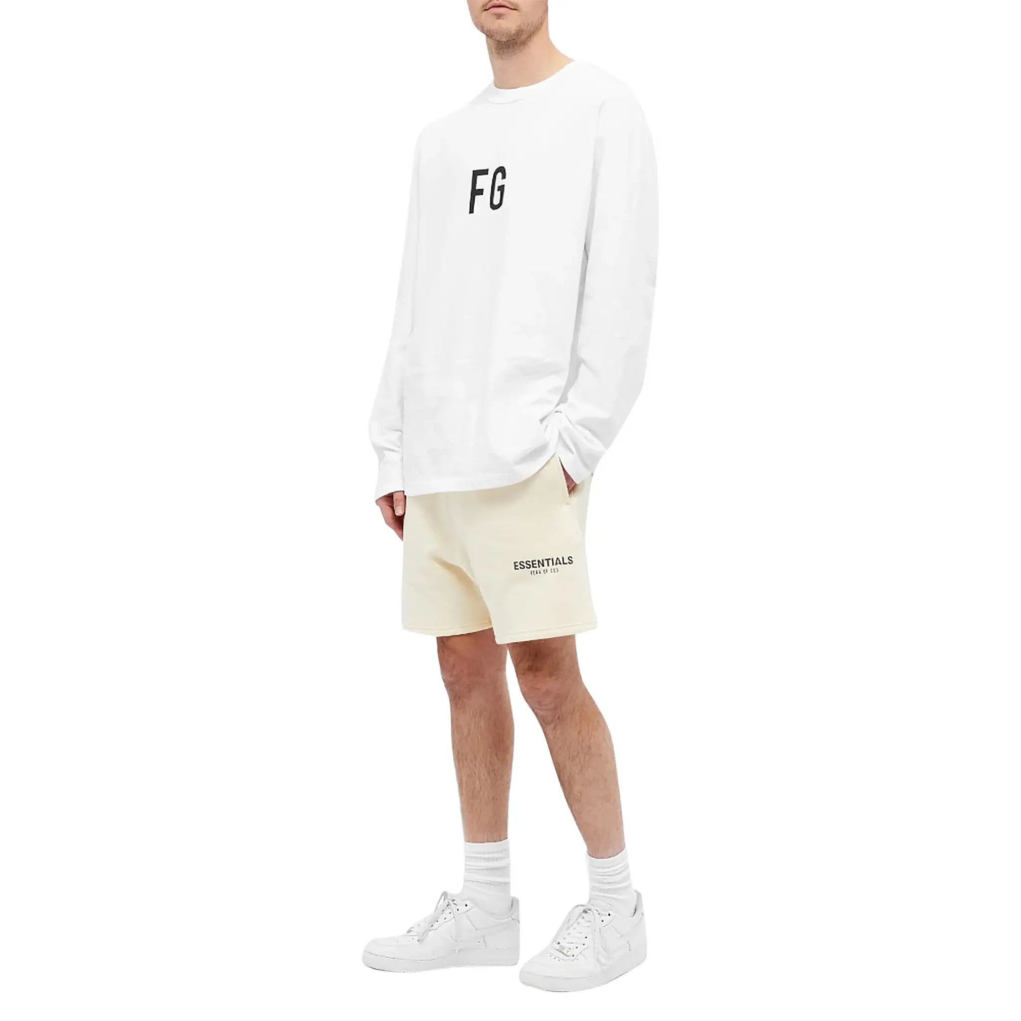 Model front view of Fear Of God Essentials Buttercream Reflective Shorts 160SP202011F