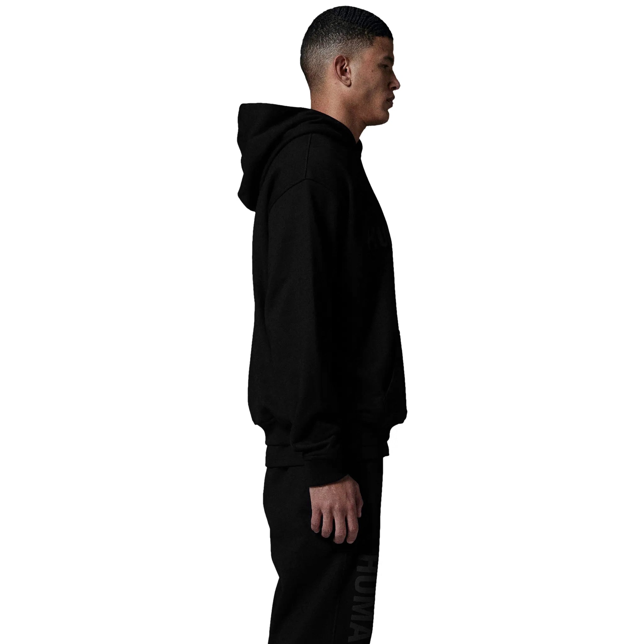 Model side view of Human Race Human Jet Black Hoodie