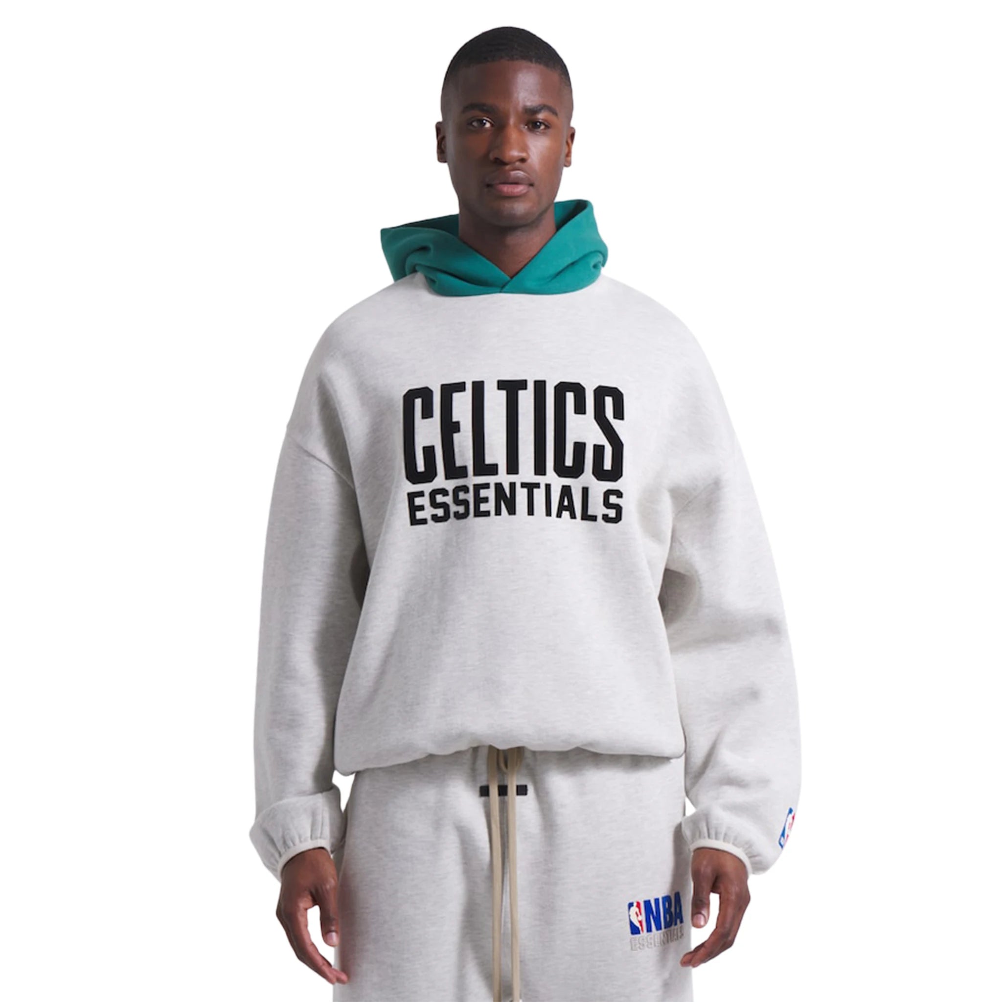 Model front view of Fear Of God Essentials x Celtics Light Heather Hoodie