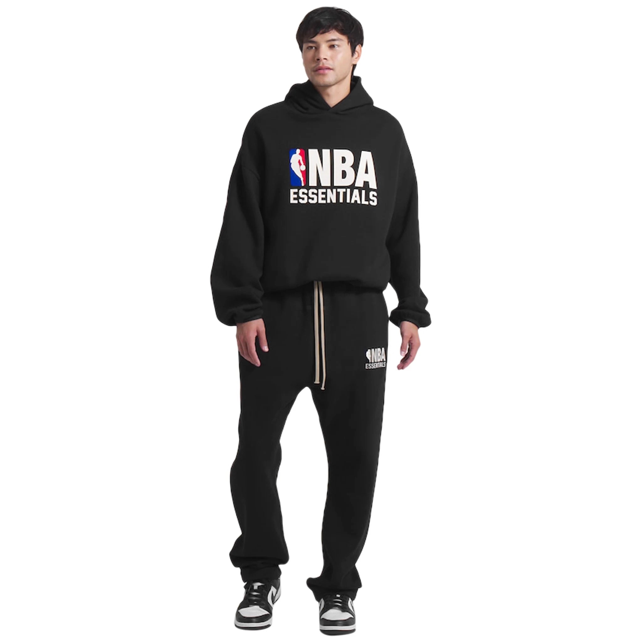 Model view of Fear of God Essentials x NBA Relaxed Black Sweatpants 130AL246001F