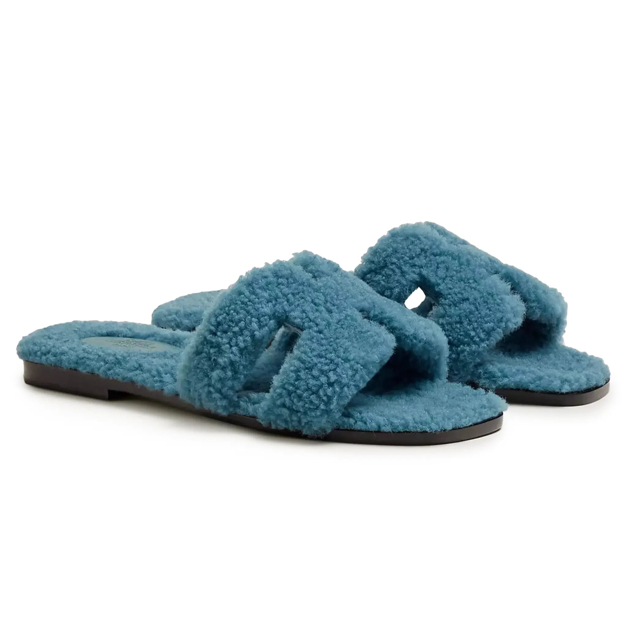 Side view of Hermes Paris Oran Blue Shearling Sandals