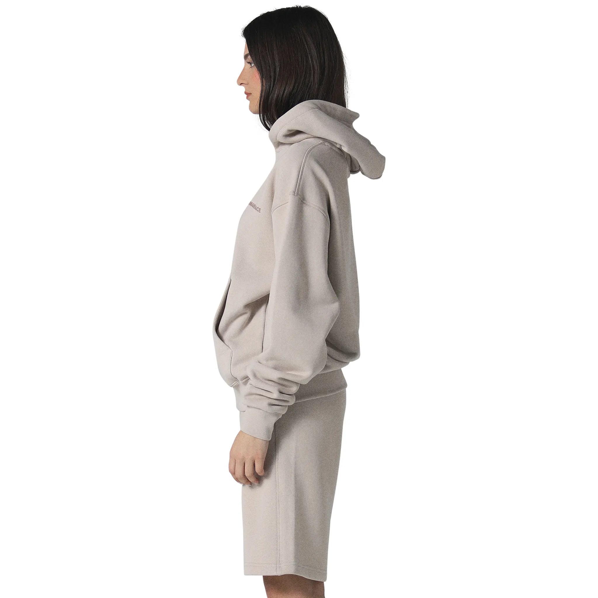 Model female side view of Human Race Erisi Deep Taupe Hoodie