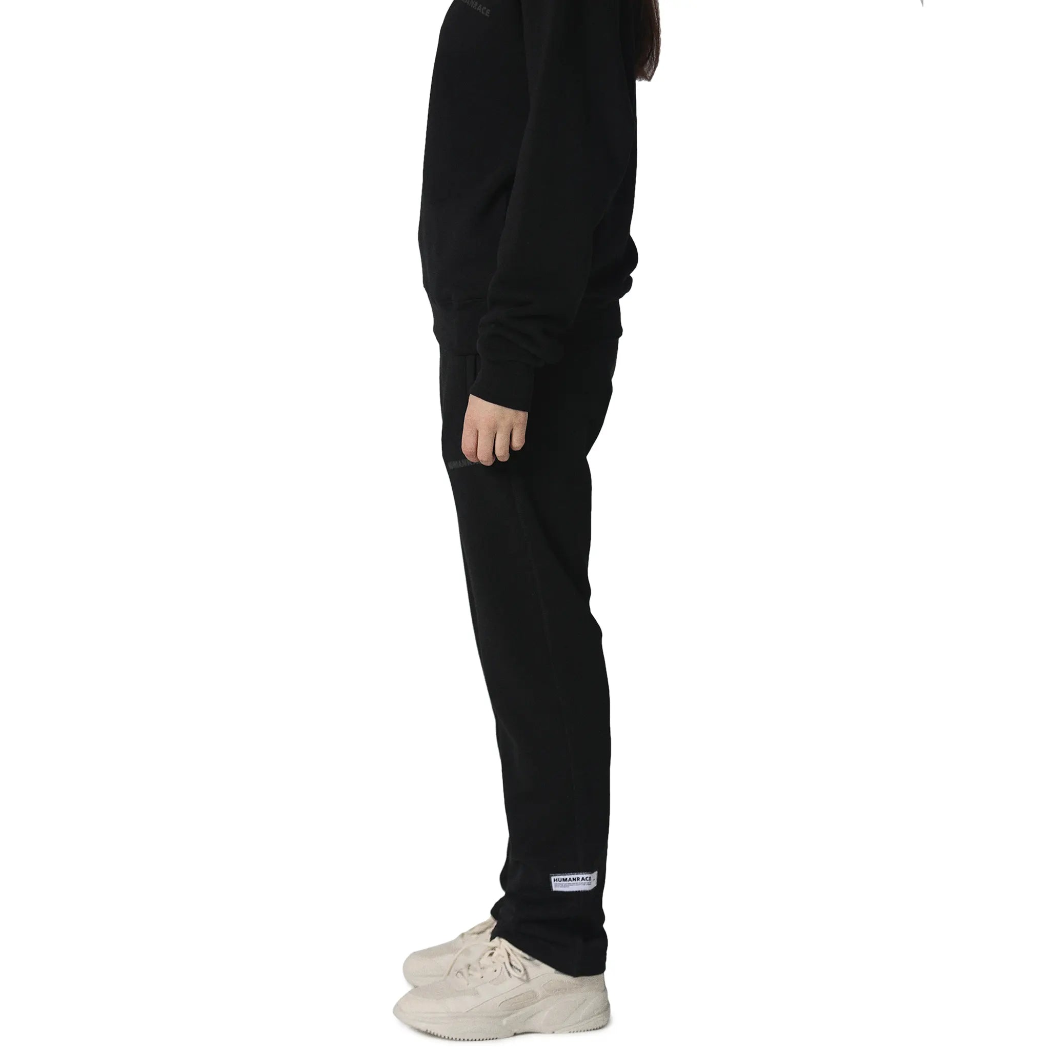 Model side view of Human Race Mars Straight Leg Black Sweatpants