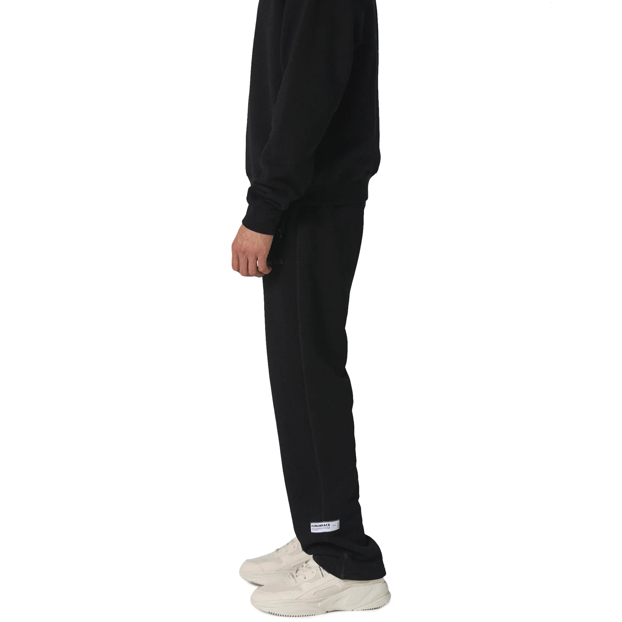 Model side view of Human Race Mars Straight Leg Black Sweatpants