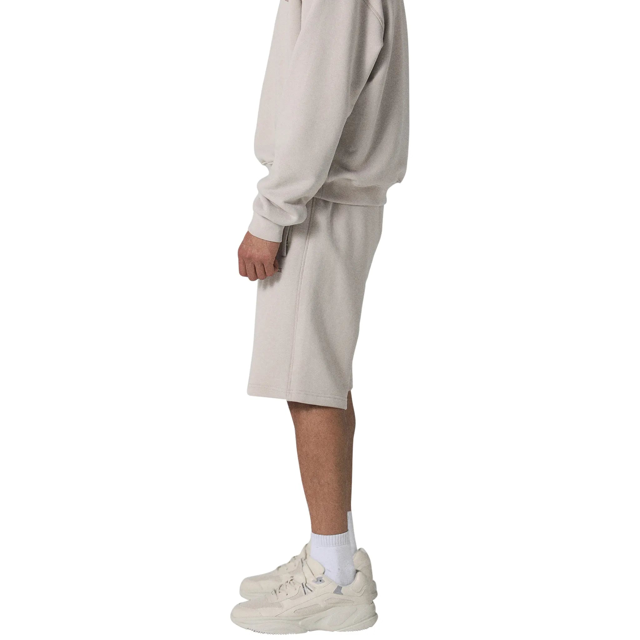 Model male side view of Human Race Stars Deep Taupe Shorts