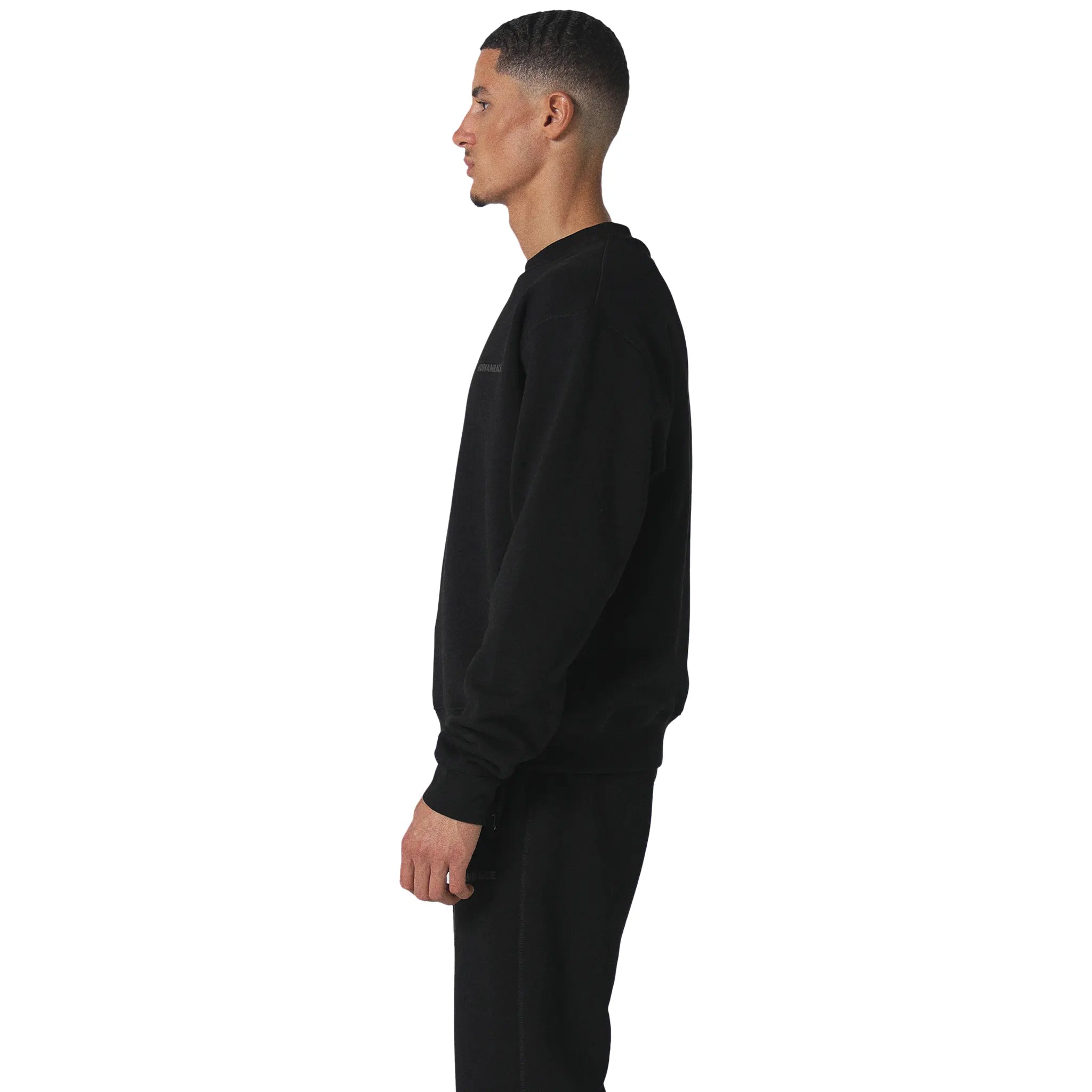 Model side view of Human Race World Black Sweatshirt