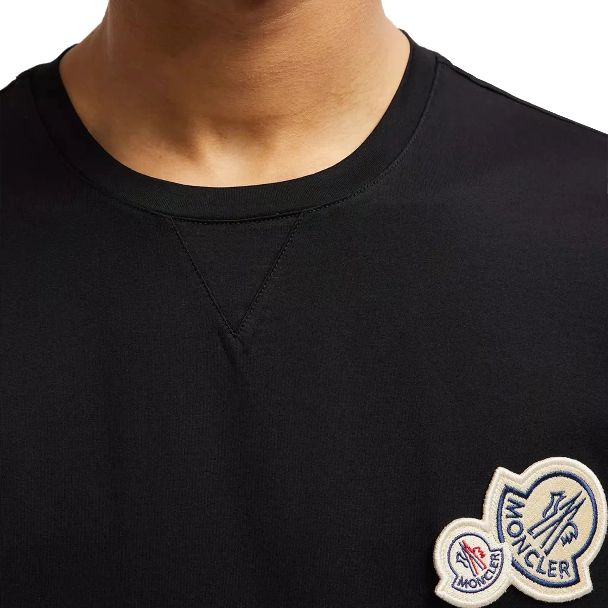 Model detail view of Moncler Double Bell Logo Black T Shirt J10918C000588390Y999