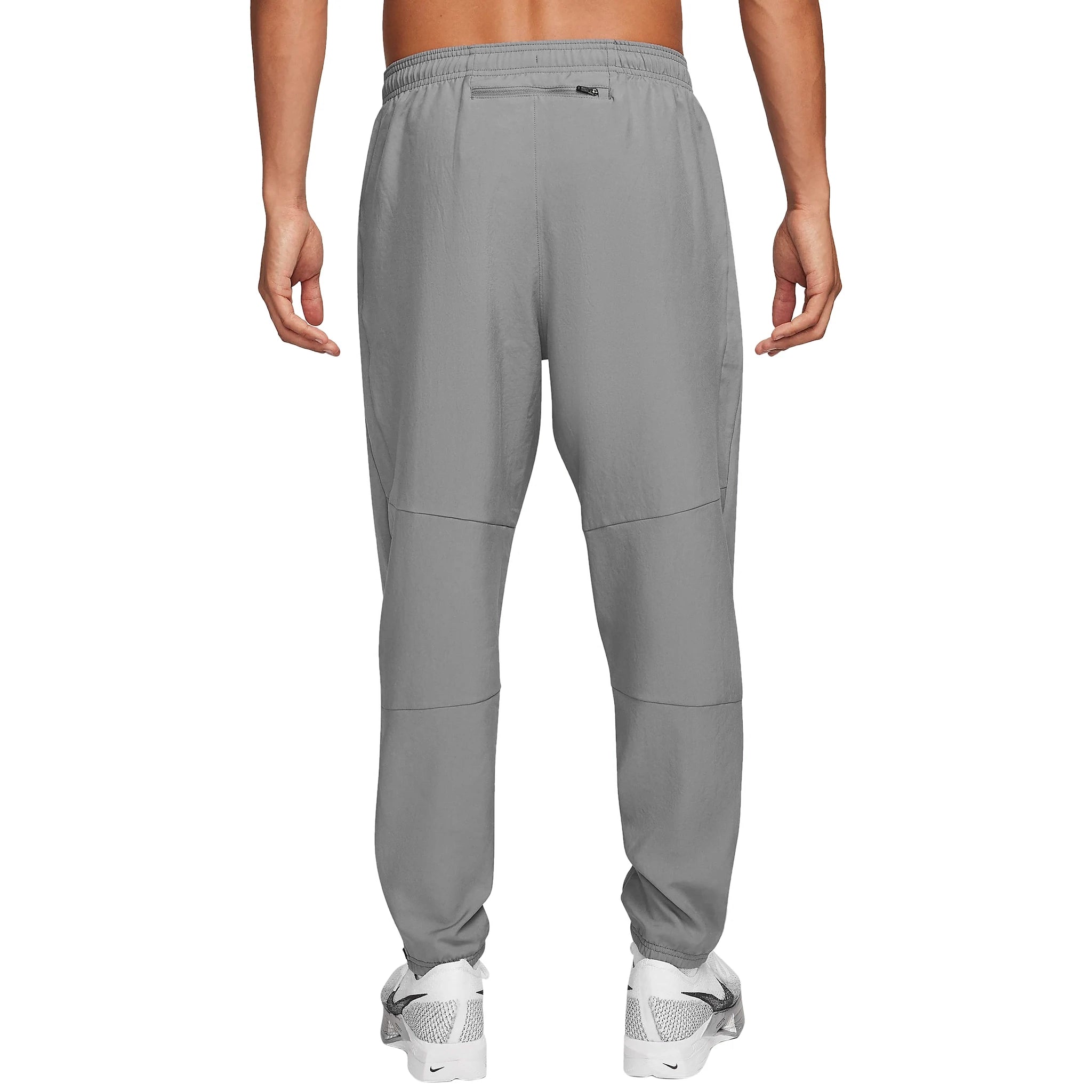 Model back view of Nike Challenger Grey Pants DD4895-084