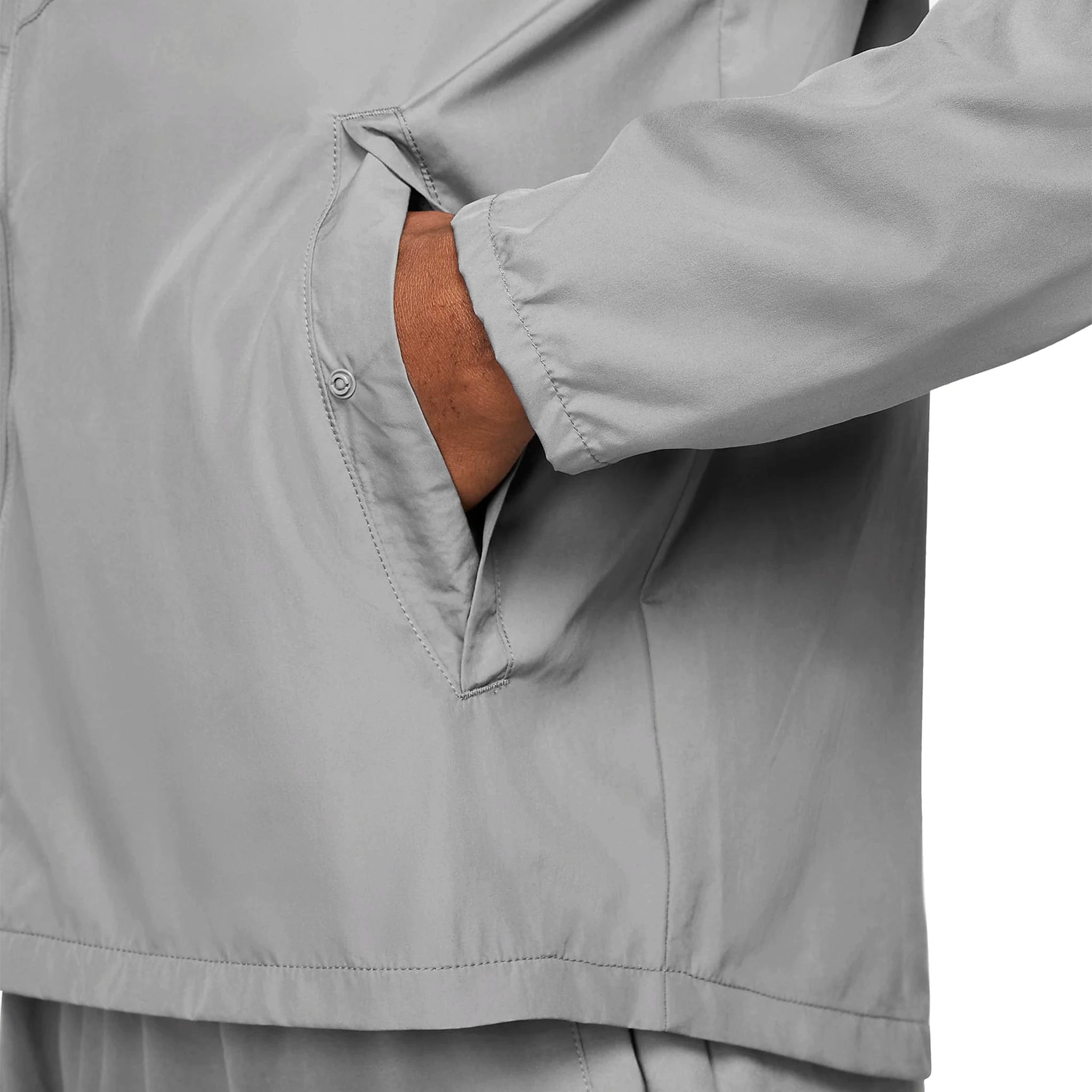 Model pocket view of Nike Miler Repel Grey Windbreaker