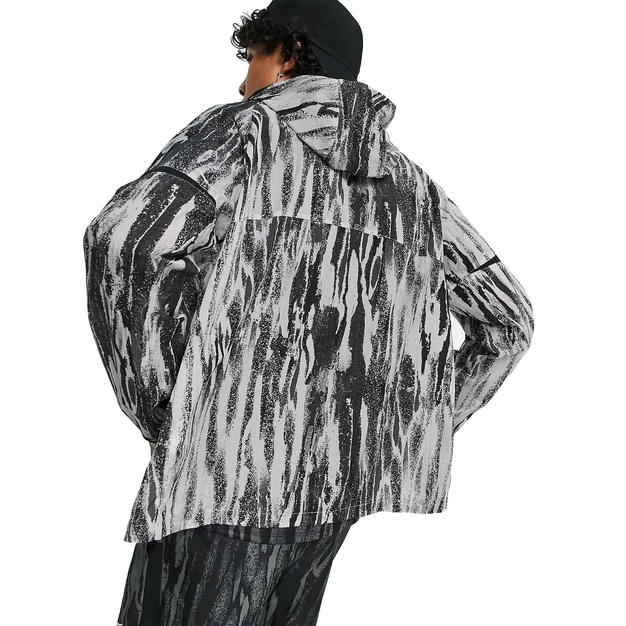 Model back view of Nike Running Wild Run Zebra Print Grey Windrunner DA1161-077