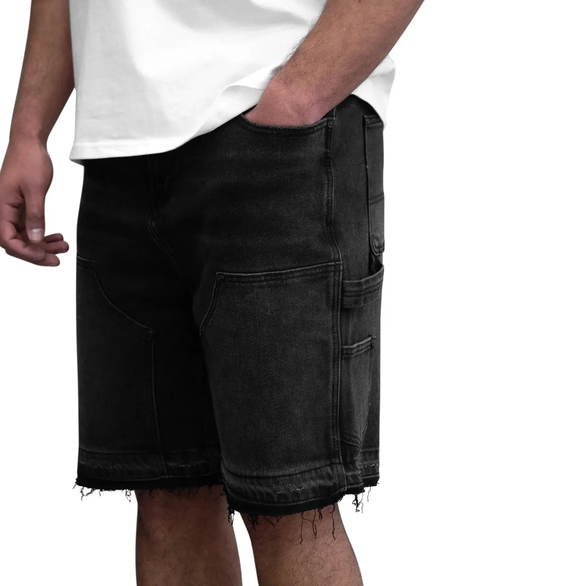 Model side close view of SIARR Carpenter Shorts Black