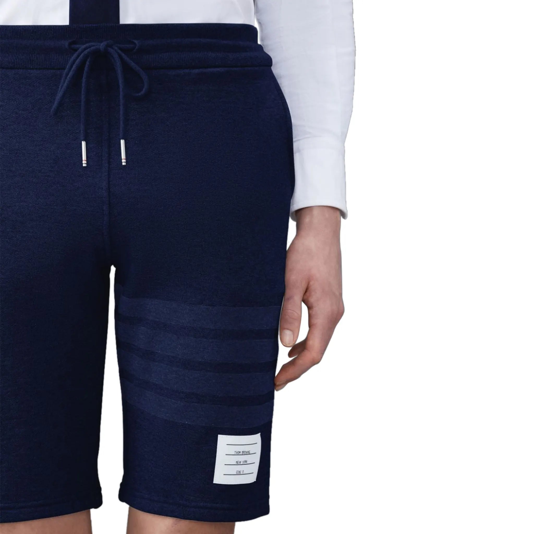 Model detail view of Thom Browne Classic Loopback 4-Bar Blue Sweat Shorts MJQ012A-06910-415