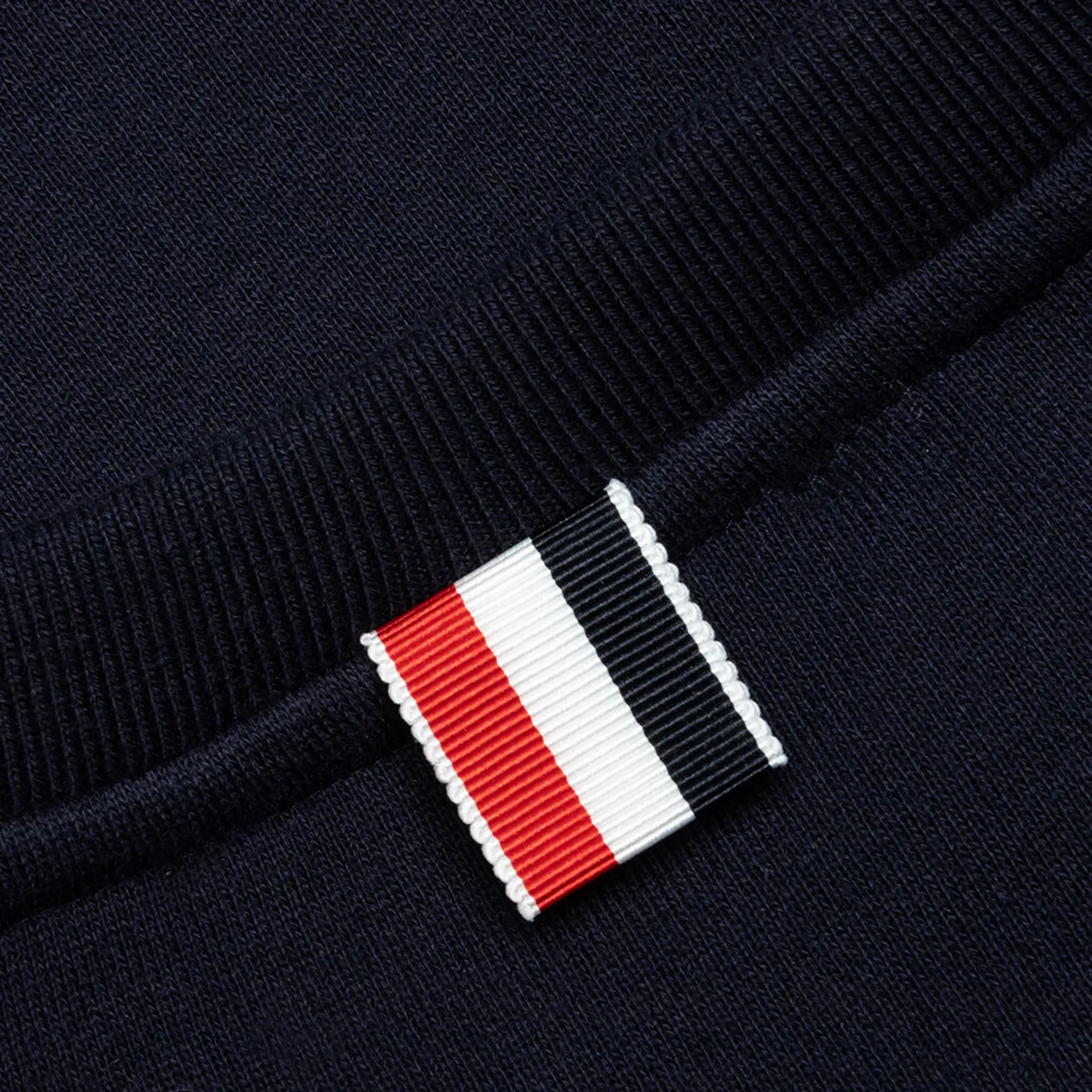 Detail view of Thom Browne Classic Loopback 4 Bar Tonal Relaxed Navy Blue Sweatshirt MJT248A-06910-415